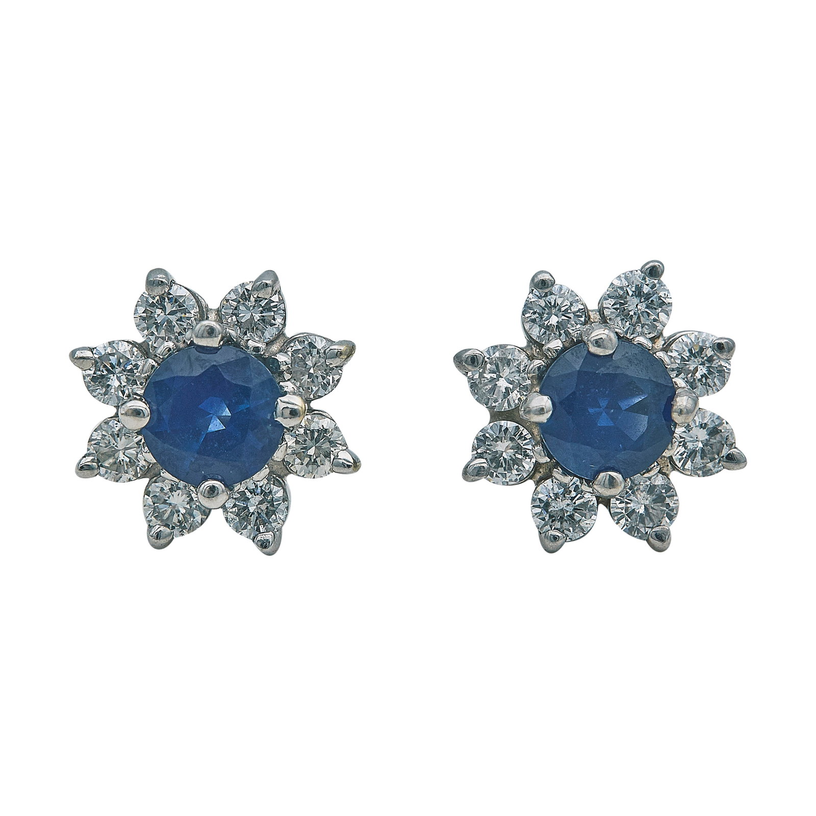 14K White Gold Sapphire and Diamond Halo Stud Earrings: METAL: 14K White Gold; APPROXIMATE TOTAL DIAMOND WEIGHT: 0.96 ctw; GEMSTONES: Sapphires approx. 5.00 mm in diameter; STAMPED: CID, 14K; CONDITION: Pre-owned, Very Good; ITEM WEIGHT (GRAMS): 2.7 g; MEA