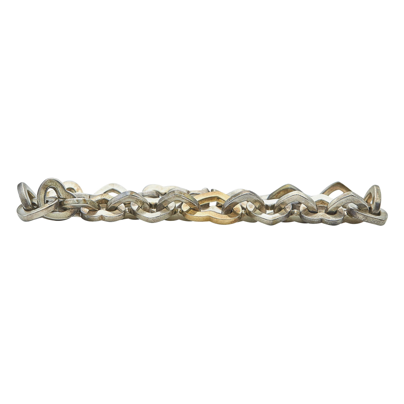 Tiffany & Co. Sterling Silver and 18K Yellow Gold Heart Link Bracelet: BRAND: Tiffany & Co.; METAL: Silver, 18K Yellow Gold; STAMPED: © 2000, Tiffany & Co., 925, 750, ITALY; CONDITION: Pre-owned, Good; ITEM WEIGHT (GRAMS): 38.52 g; MEASUREMENTS: Interior circumference a