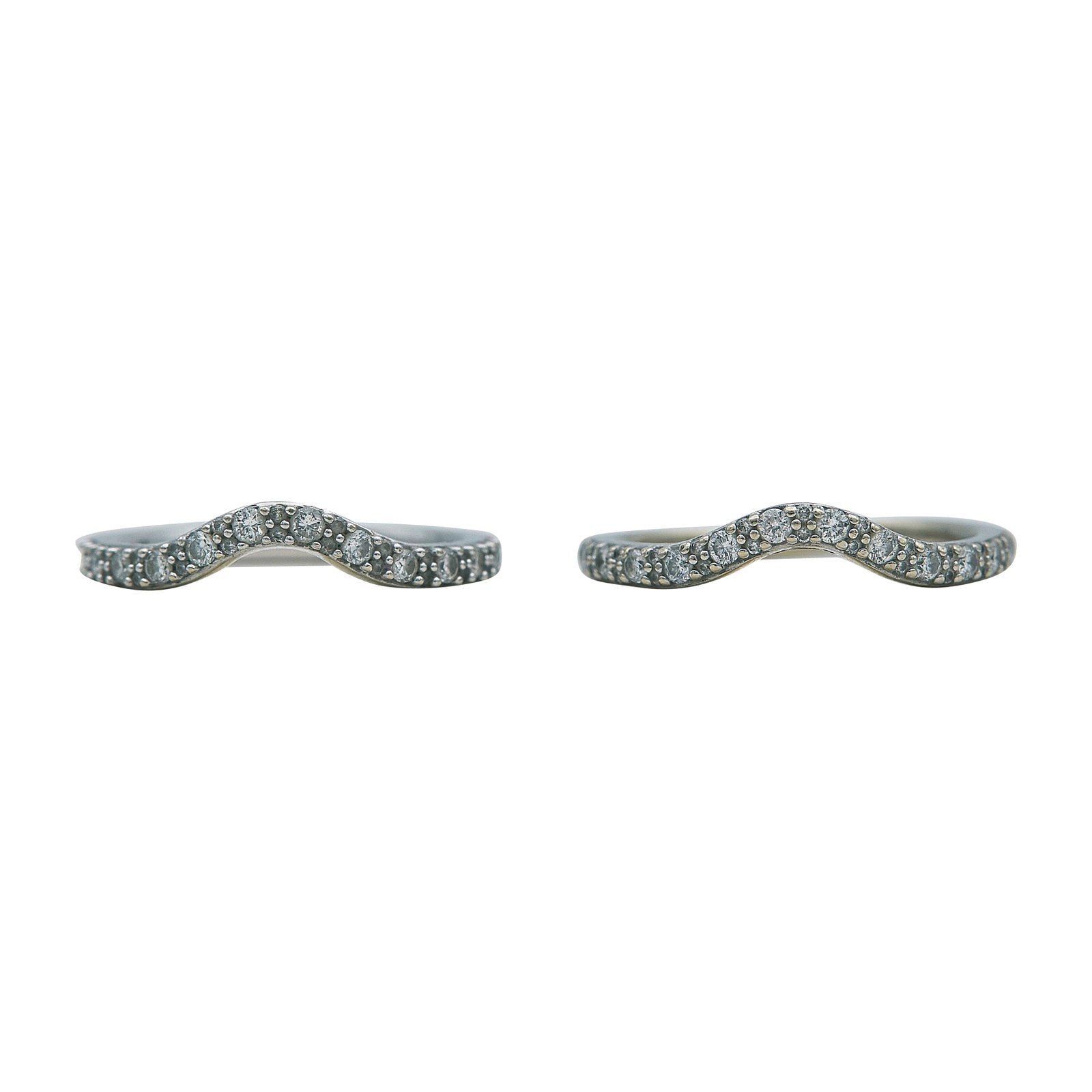 14K White Gold and Diamond Band Ring Set: METAL: 14K White Gold; APPROXIMATE TOTAL DIAMOND WEIGHT: 0.59 ctw; STAMPED: 14K, serial number; CONDITION: Pre-owned, Good; ITEM WEIGHT (GRAMS): 4.7 g; MEASUREMENTS: First ring size 7, Second ring siz