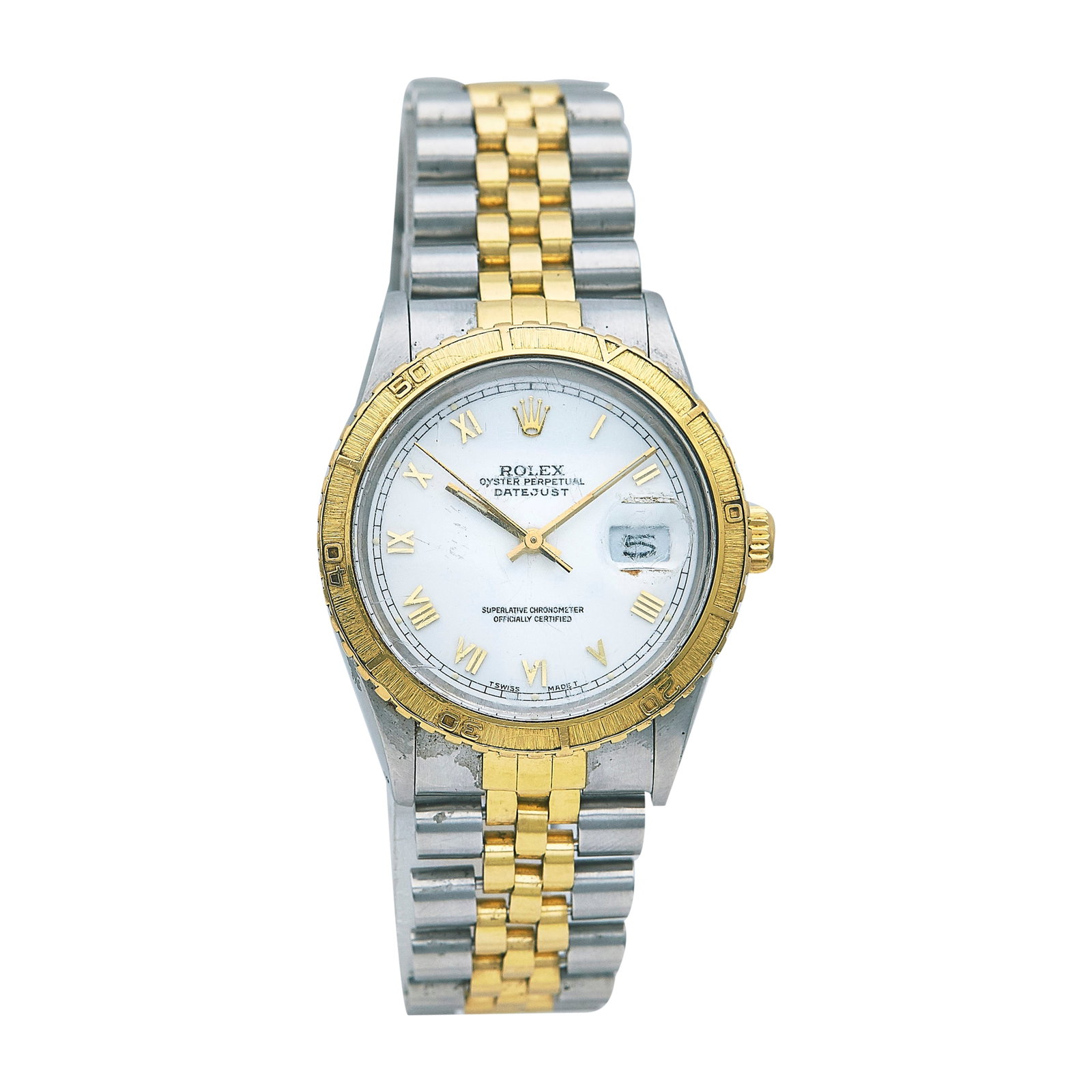 Rolex Oyster Perpetual Datejust Turn-O-Graph 18K Yellow Gold/SS Watch Ref. 16253, circa 1987: BRAND: Rolex; STYLE: Datejust; REF. #: 16253; CONDITION: Pre-owned, Good; YEAR: Circa 1987; ADDITIONAL COMMENTS: 9.8 mil serial, Scratches throughout watch, Scratches throughout crystal, Bezel stuck n