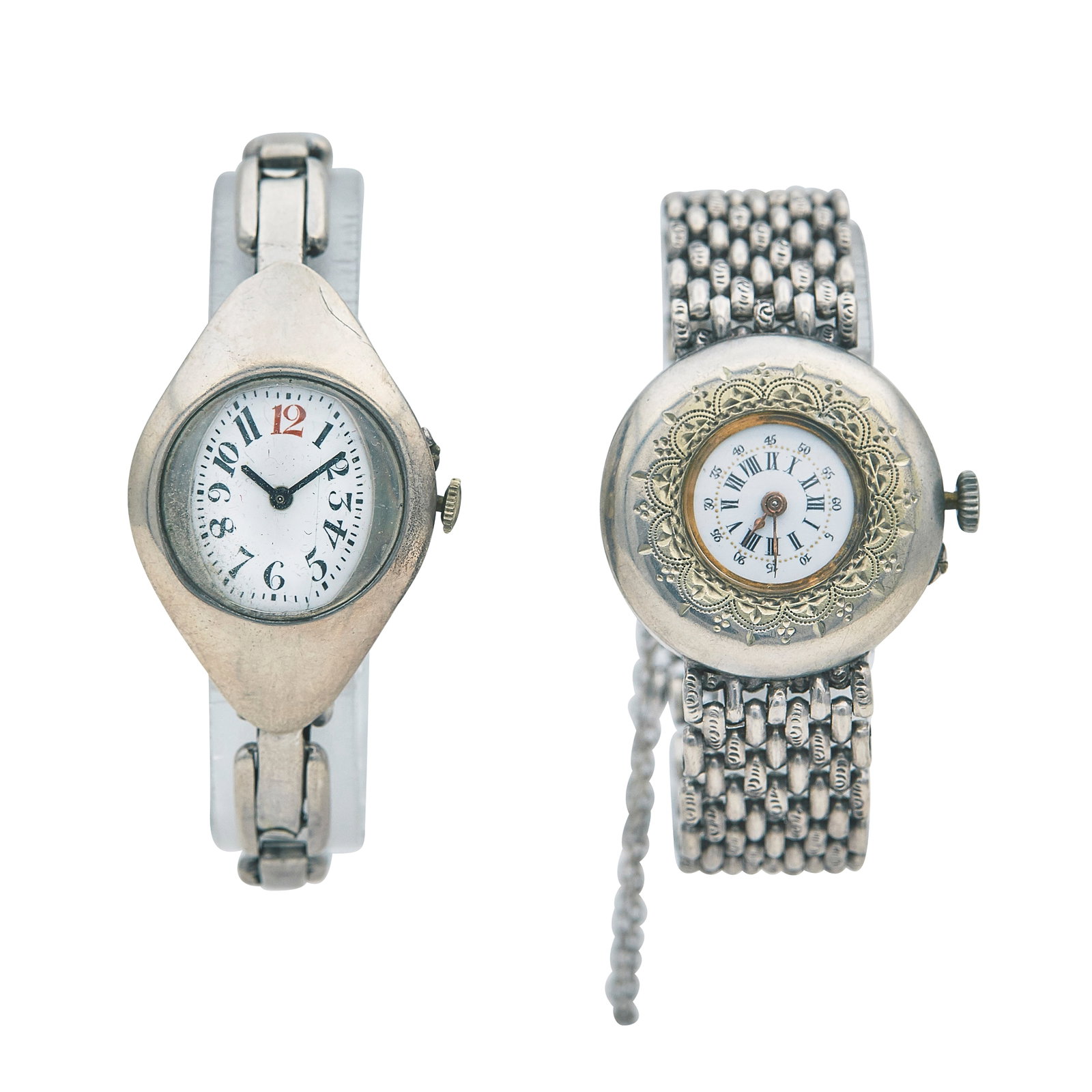 Set of Two Silver and Base Metal Wristwatches Ref. Unknown, ca. 1920: CONDITION: Pre-owned, Fair; YEAR: Circa 1900; ADDITIONAL COMMENTS: Scratches through watches, Scratches throughout plastic crystals, Watches are decorative-Service required; CASE SIZE (mm): 32; CASE M
