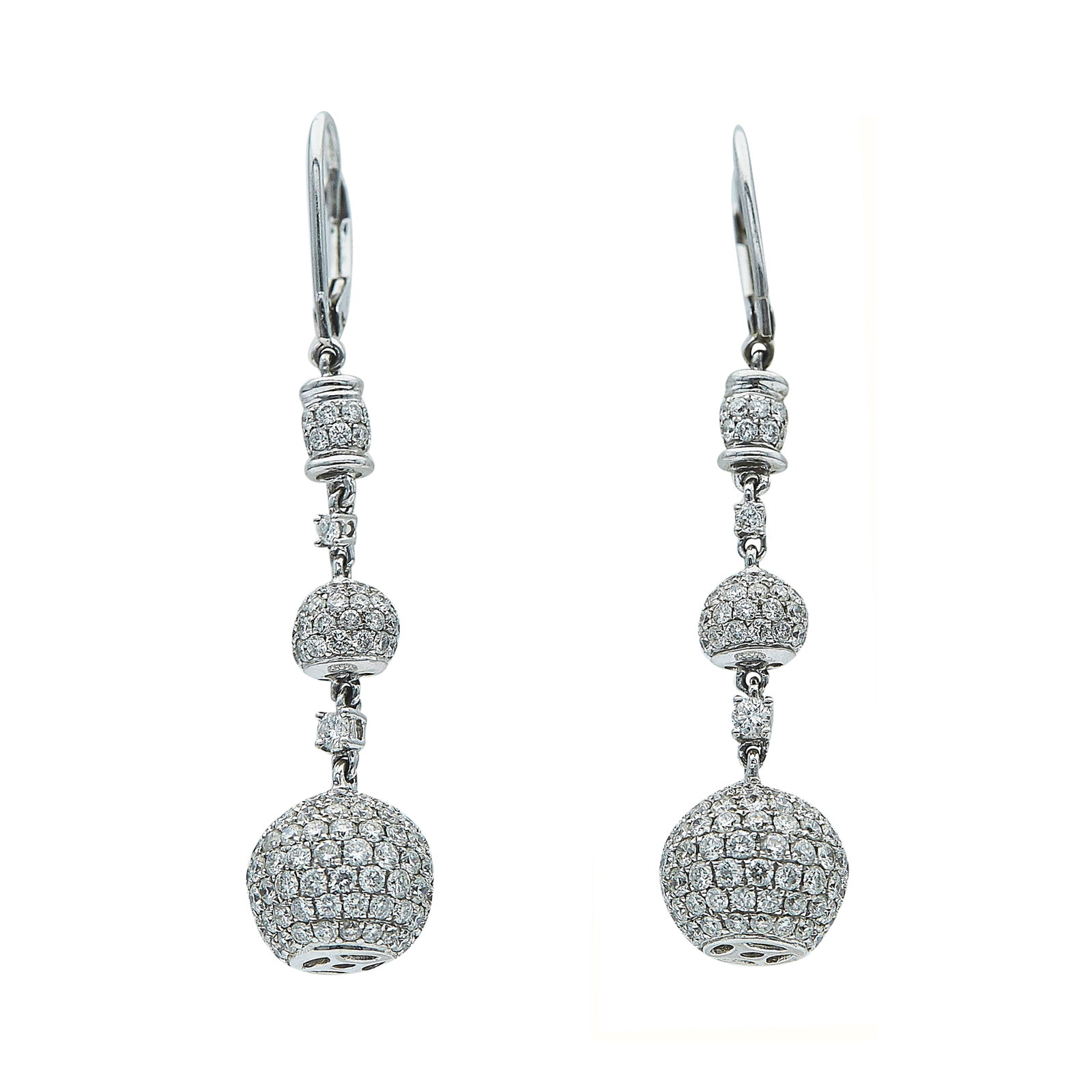 Odelia 18K White Gold and Diamond Ball Drop Earrings: BRAND: Odelia; METAL: 18K White Gold; APPROXIMATE TOTAL DIAMOND WEIGHT: 3 ctw; STAMPED: Odelia, 18KT; CONDITION: Pre-owned, Very Good; ITEM WEIGHT (GRAMS): 7.4 g; MEASUREMENTS: Earrings 1 3/4 inch lon