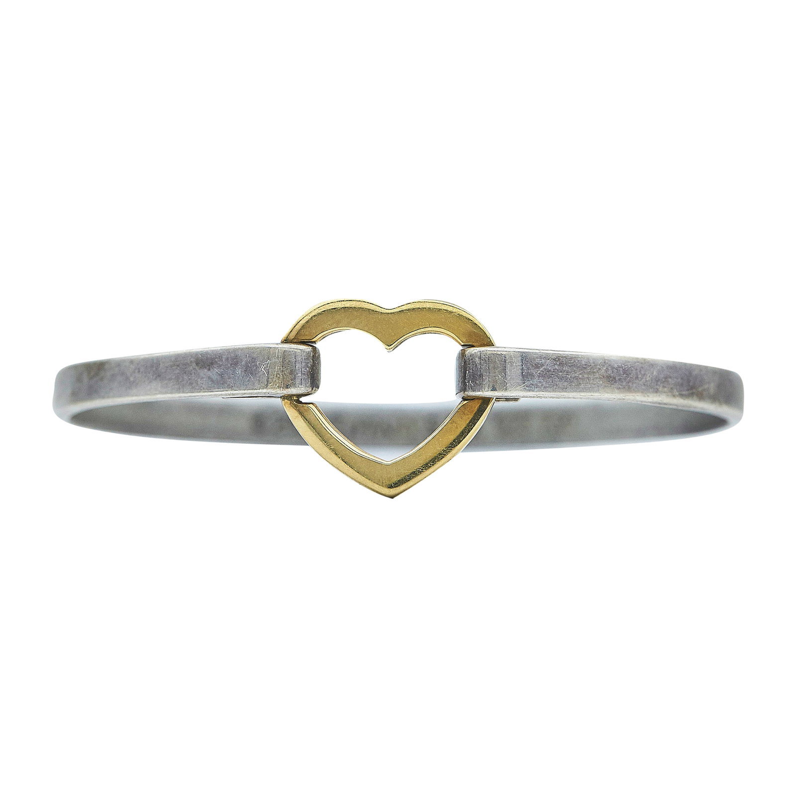Tiffany & Co. Sterling Silver and 18K Yellow Gold Heart Bangle Bracelet: BRAND: Tiffany & Co.; METAL: 18K Yellow Gold/Silver; STAMPED: © 2003 Tiffany & Co., 925, 750; CONDITION: Pre-owned, Good; ITEM WEIGHT (GRAMS): 13.8 g; MEASUREMENTS: Bracelet interior circumference ap