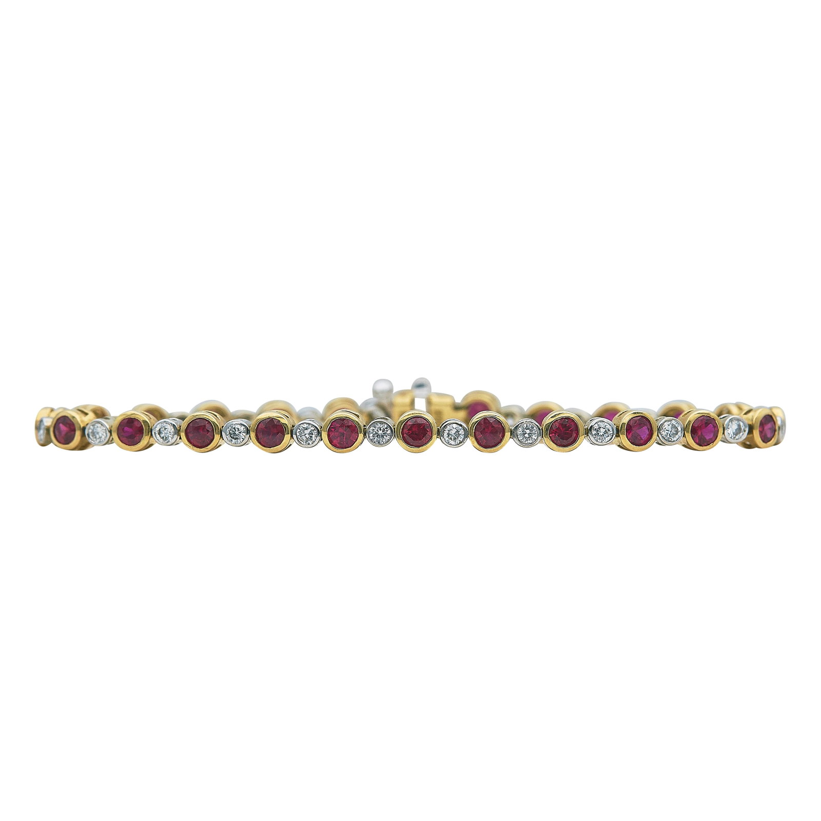 18K Yellow and White Gold Ruby and Diamond Tennis Bracelet: METAL: 18K Yellow Gold/White Gold; APPROXIMATE TOTAL DIAMOND WEIGHT: 0.72 ctw; GEMSTONES: Ruby; STAMPED: 750, IDGC; CONDITION: Pre-owned, Very Good; ITEM WEIGHT (GRAMS): 11.4 g; MEASUREMENTS: Bracelet