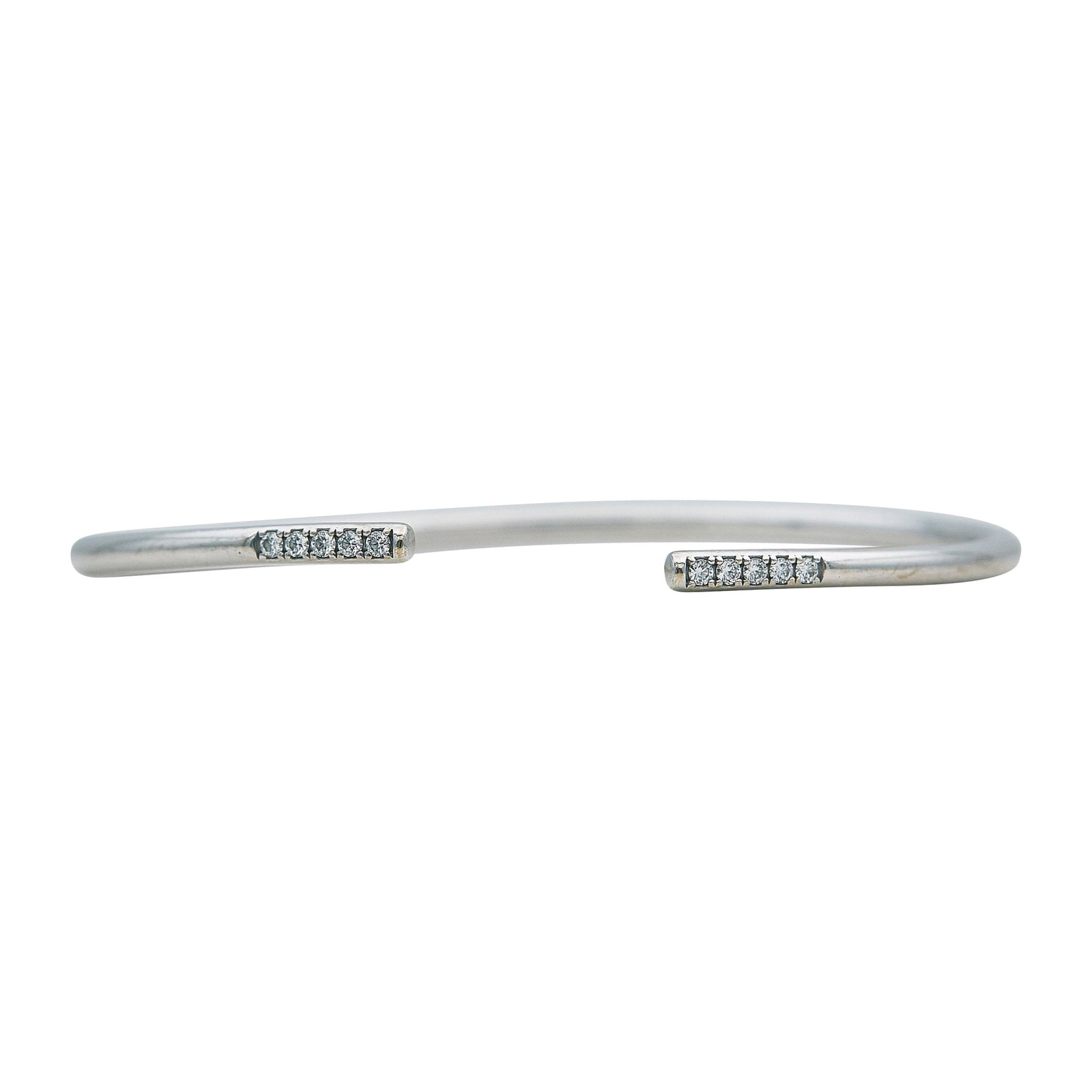 Tiffany & Co. Metro 18K White Gold and Diamond Cuff Bracelet: BRAND: Tiffany & Co.; COLLECTION: Metro; METAL: 18K White Gold; APPROXIMATE TOTAL DIAMOND WEIGHT: 0.15 ctw; STAMPED: © Tiffany & Co., Au750; CONDITION: Pre-owned, Good; ITEM WEIGHT (GRAMS): 5.5 g; ME