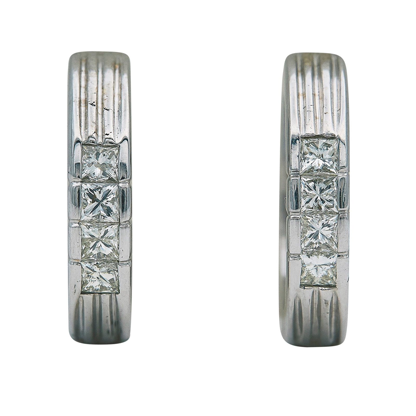 14K White Gold and Princess Cut Diamond Hoop Earrings: METAL: 14K White Gold; APPROXIMATE TOTAL DIAMOND WEIGHT: 0.80 ctw; TESTED: 14K White Gold; CONDITION: Pre-owned, Very Good; ITEM WEIGHT (GRAMS): 8.9 g; MEASUREMENTS: Earrings 3/4 inch long x 3/16
