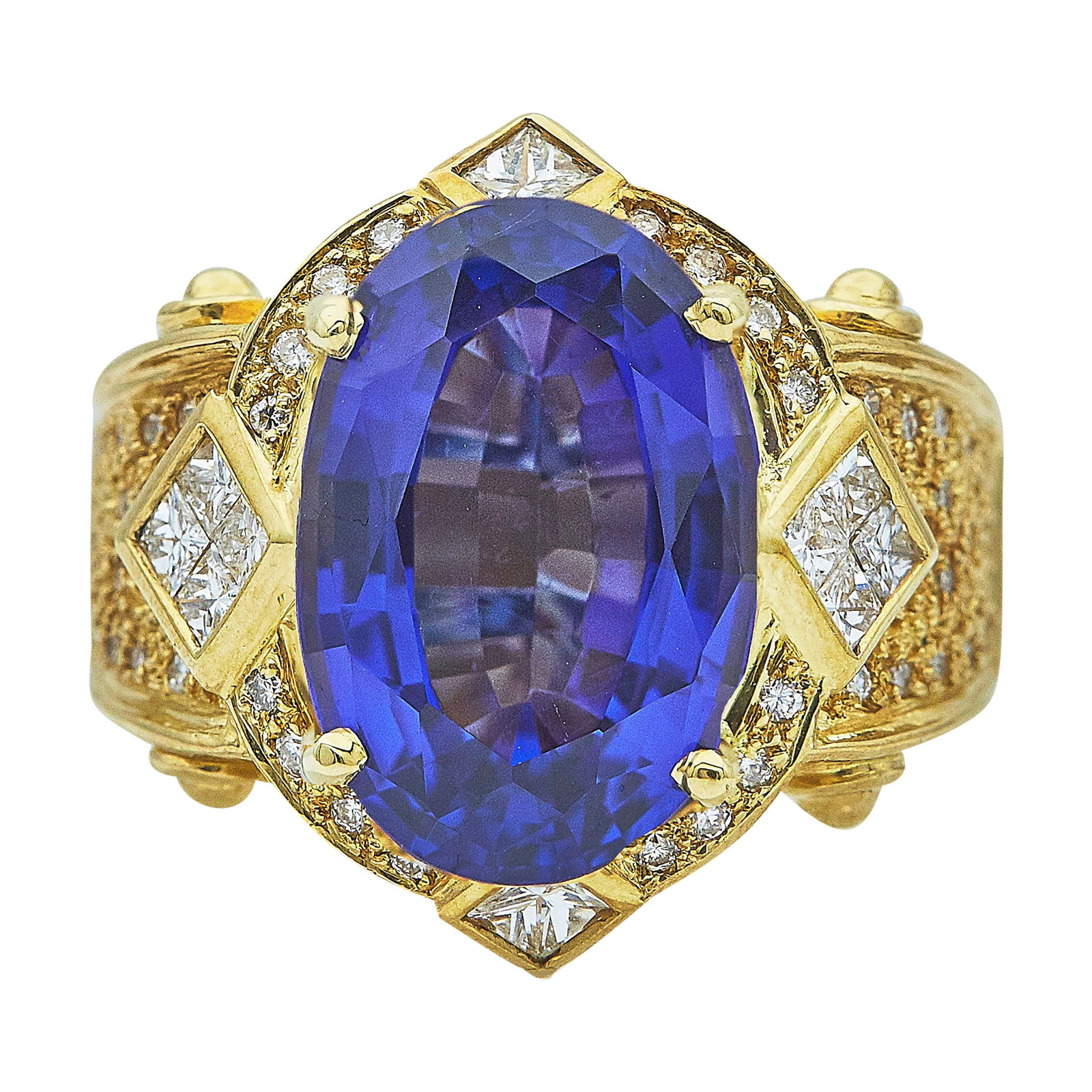 18K Yellow Gold Tanzanite and Diamond Cocktail Ring: METAL: 18K Yellow Gold; APPROXIMATE TOTAL DIAMOND WEIGHT: 0.65 ctw; GEMSTONES: Tanzanite weighs approx. 7.72 carats, Weight estimated by formula; STAMPED: 750, 18K, Maker's mark; CONDITION: Pre-owned,