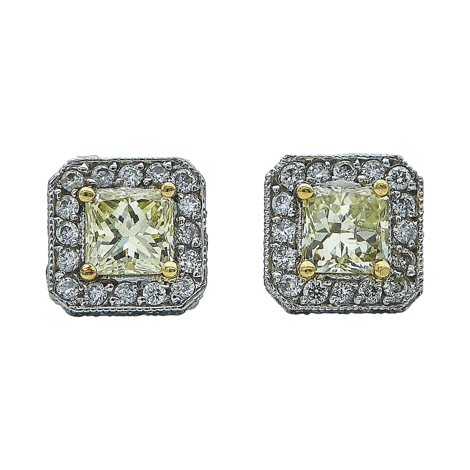 Platinum and 18k Yellow Gold Yellow and White Diamond Stud Earrings: METAL: 18K Yellow Gold/Platinum; APPROXIMATE TOTAL DIAMOND WEIGHT: 0.20 ctw; GEMSTONES: Yellow Diamonds approx. 0.66 carat, Weight estimated by formula; STAMPED: Backs marked: PLAT; TESTED: 18K Yellow