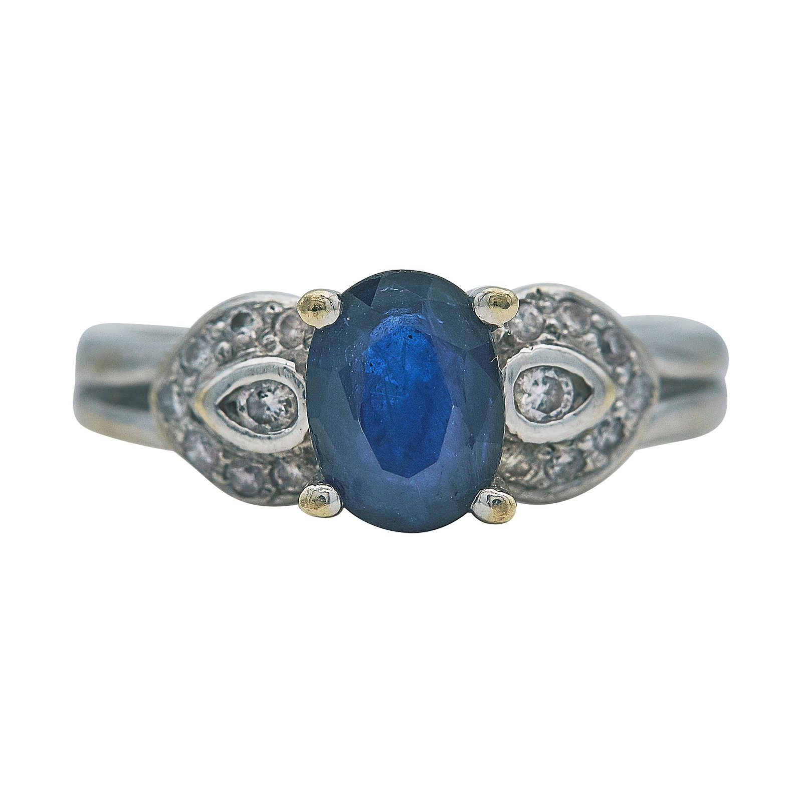 18K White Gold Sapphire and Diamond Ring: METAL: 18K White Gold; APPROXIMATE TOTAL DIAMOND WEIGHT: 0.10 ctw; GEMSTONES: Sapphire approx. 0.91 carat, Weight estimated by formula; STAMPED: 750; CONDITION: Pre-owned, Very Good; ITEM WEIGHT (GRAM