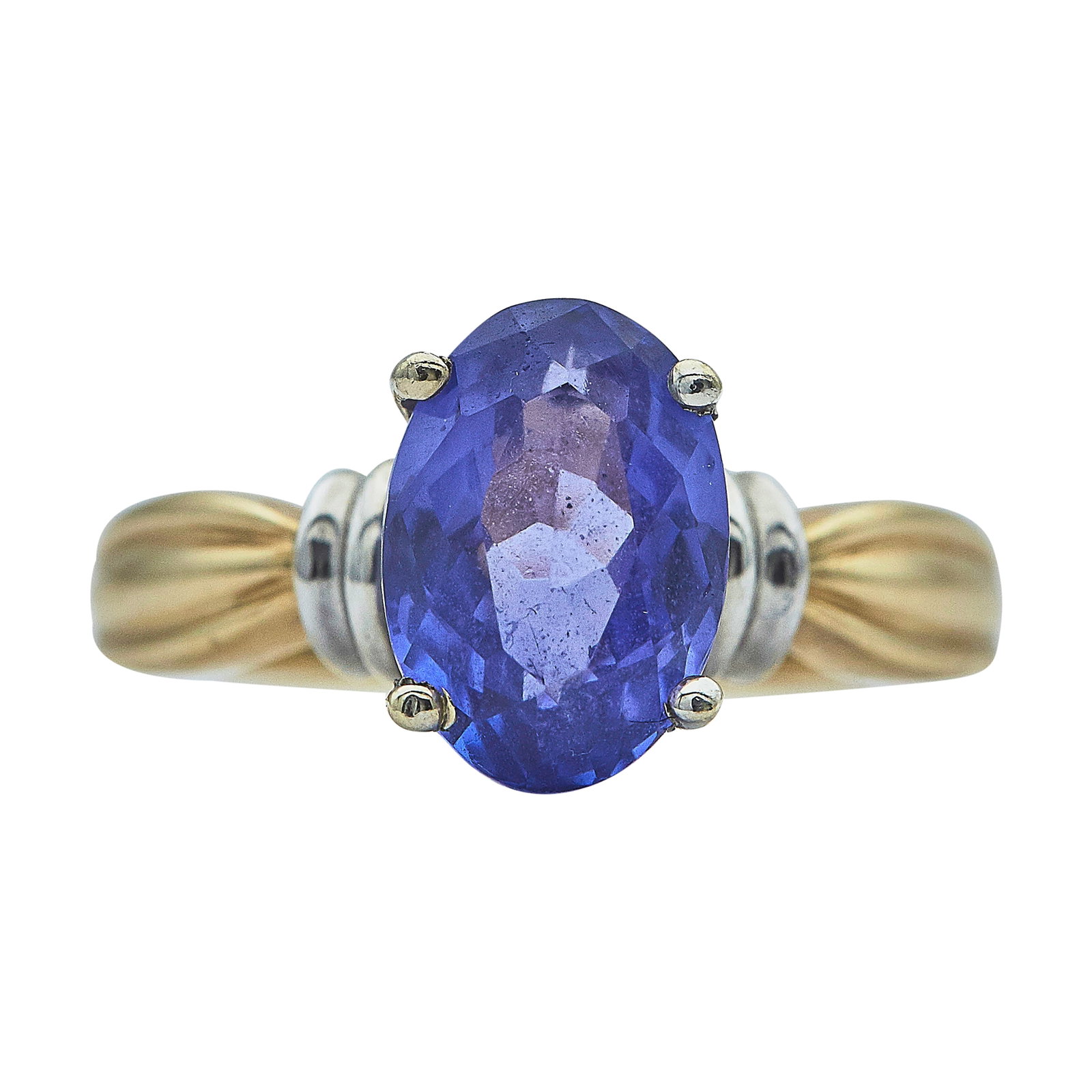 14K Yellow and White Gold Tanzanite Solitaire Ring: METAL: 14K Yellow Gold/White Gold; GEMSTONES: Tanzanite approx. 2.39 carats, Weight estimated by formula; STAMPED: 14K, Maker's Mark; CONDITION: Pre-owned, Very Good; ITEM WEIGHT (GRAMS): 4.3 g; MEASU