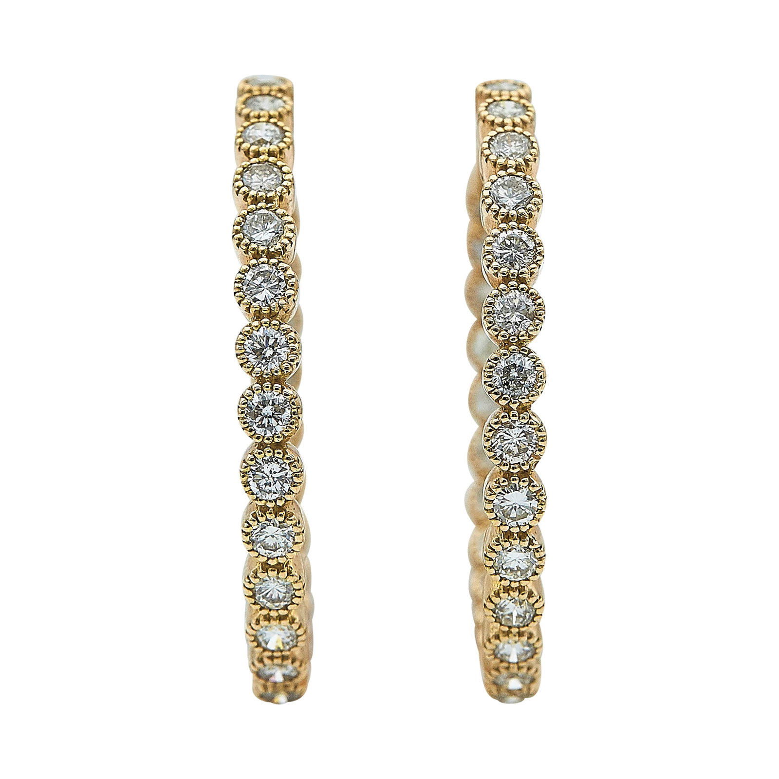 18K Yellow Gold and Diamond Inside Out Hoop Earrings: METAL: 18K Yellow Gold; APPROXIMATE TOTAL DIAMOND WEIGHT: 3 ctw; TESTED: 18K Yellow Gold; CONDITION: Pre-owned, Very Good; ITEM WEIGHT (GRAMS): 13.8 g; MEASUREMENTS: Earrings 1 1/2 inch in diameter