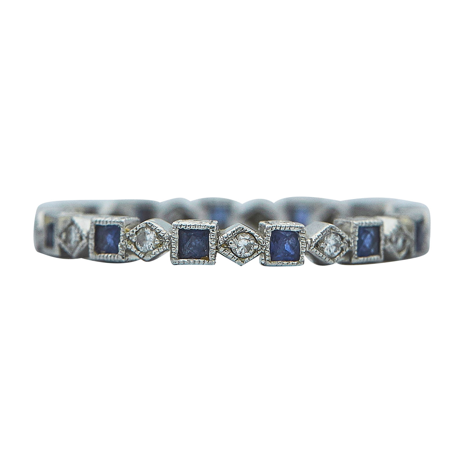 Platinum Sapphire and Diamond Band Ring: METAL: Platinum; APPROXIMATE TOTAL DIAMOND WEIGHT: 0.13 ctw; GEMSTONES: Sapphire; STAMPED: PT900; CONDITION: Pre-owned, Good; ITEM WEIGHT (GRAMS): 1.9 g; MEASUREMENTS: Ring size 4 3/4; Diamonds and