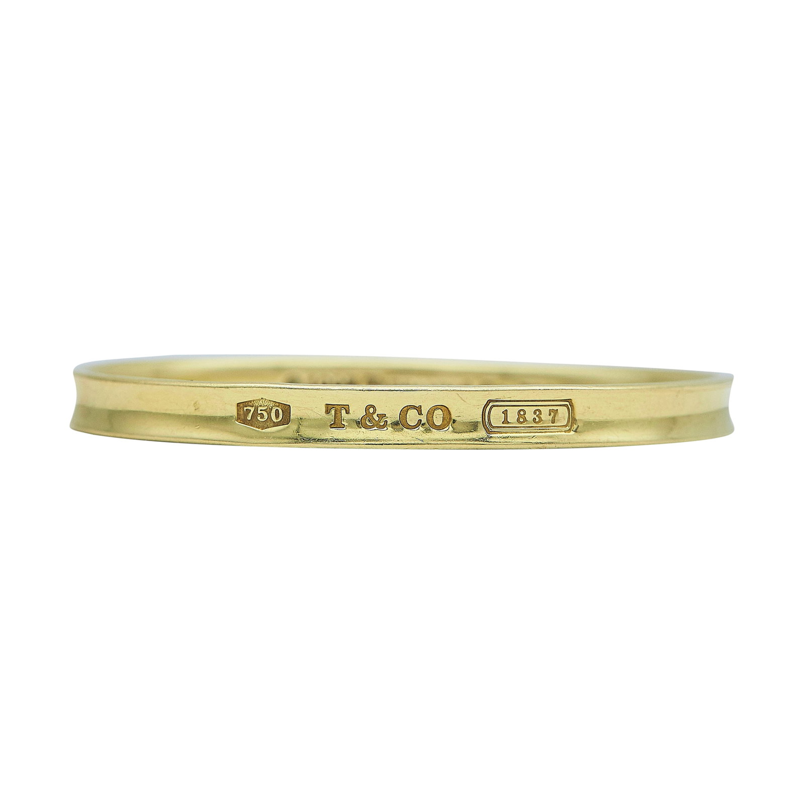 Tiffany & Co. 1837 18K Yellow Gold Bangle Bracelet: BRAND: Tiffany & Co.; COLLECTION: 1837; METAL: 18K Yellow Gold; STAMPED: © 1997, Tiffany & Co., 750; CONDITION: Pre-owned, Good; ITEM WEIGHT (GRAMS): 28.1 g; MEASUREMENTS: Bracelet interior width app