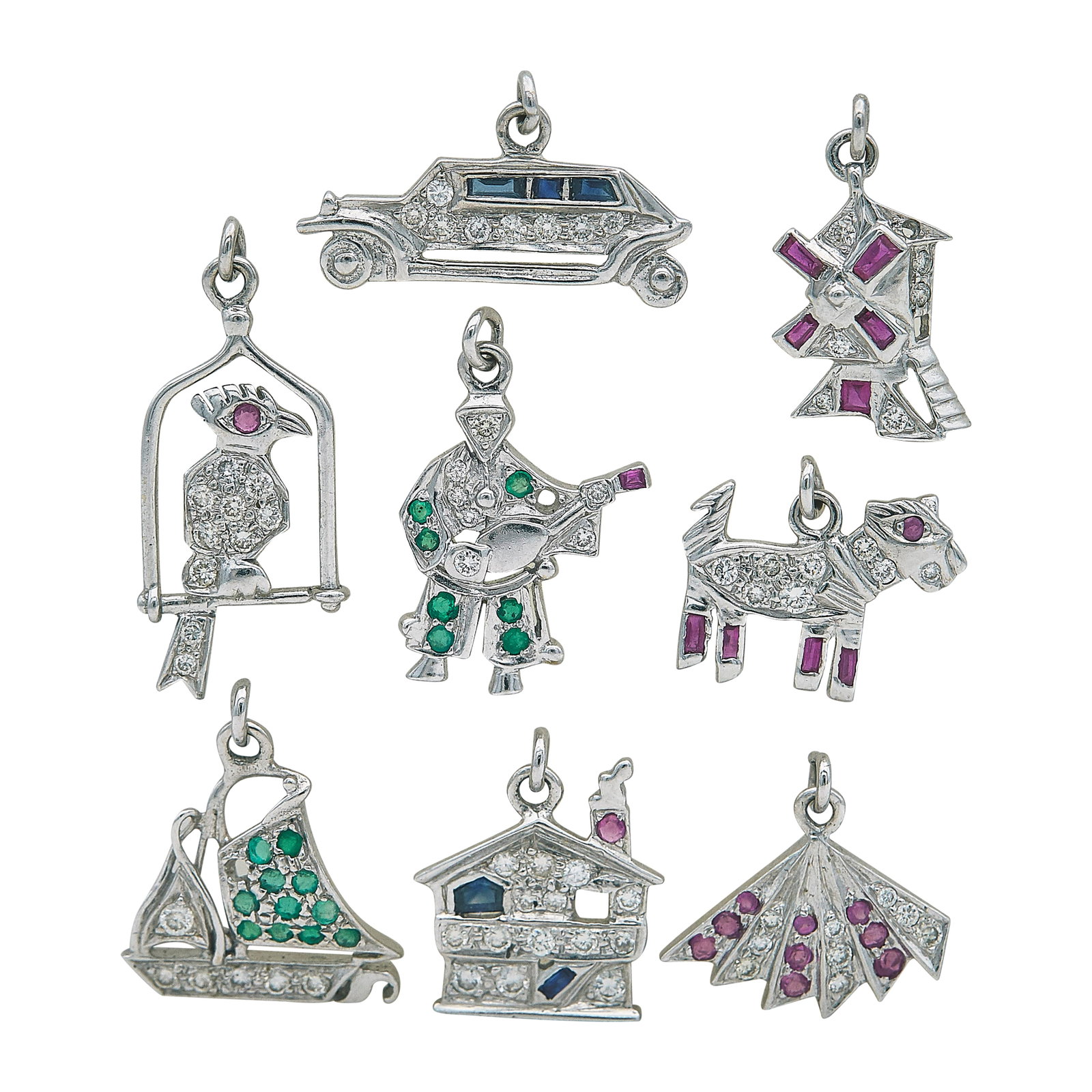 Platinum, Diamond, Emerald, Sapphire, and Ruby Charm Lot: METAL: Platinum; APPROXIMATE TOTAL DIAMOND WEIGHT: 0.67 ctw; GEMSTONES: Emerald, Sapphire, and Ruby; TESTED: Platinum; CONDITION: Pre-owned, Fair; ITEM WEIGHT (GRAMS): 12.3 g; MEASUREMENTS: Charms var