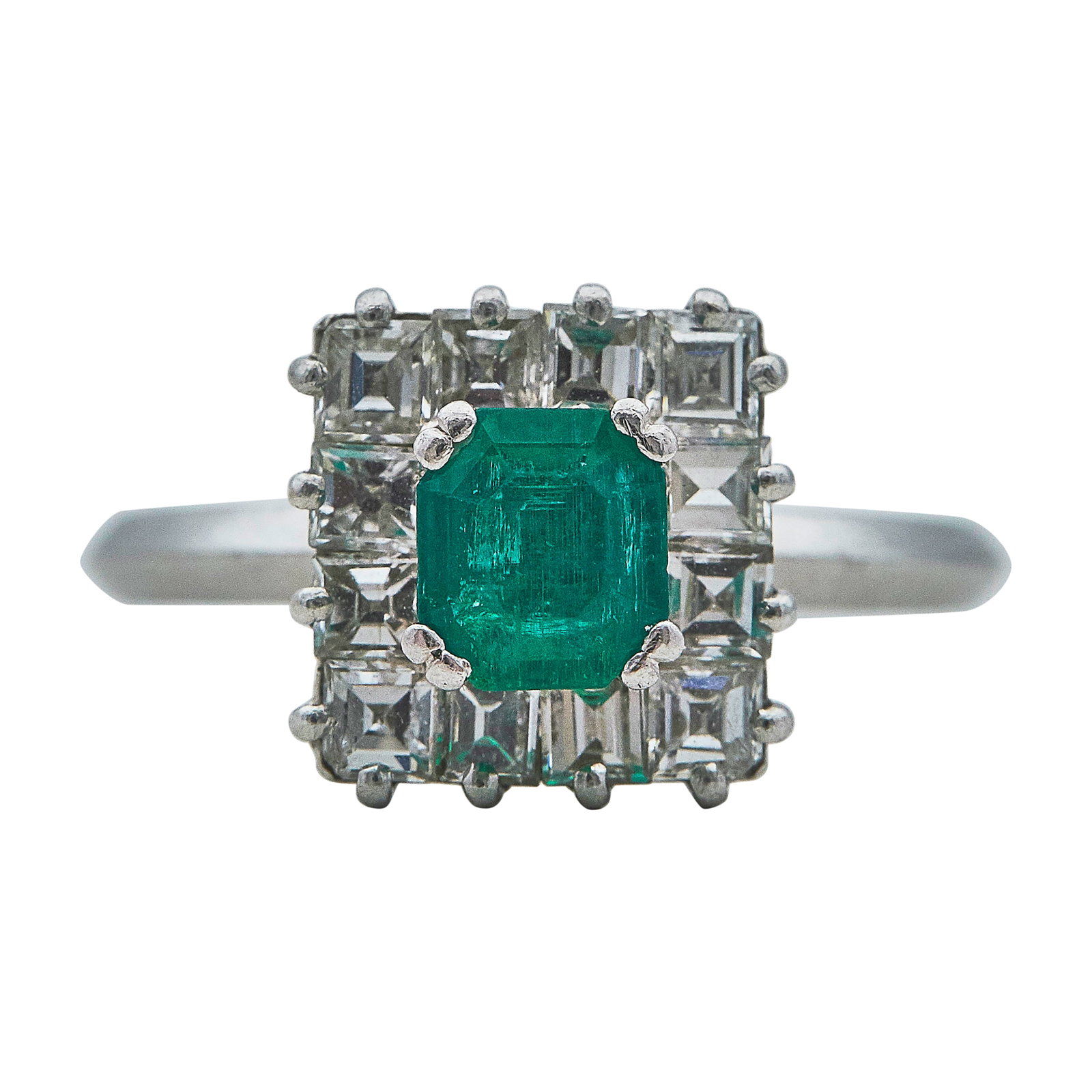 Platinum, Emerald, and Diamond Cluster Ring: METAL: Platinum; APPROXIMATE TOTAL DIAMOND WEIGHT: 1.20 ctw; GEMSTONES: Emerald approx. 0.87 carat; TESTED: Platinum; CONDITION: Pre-owned, Very Good; ITEM WEIGHT (GRAMS): 6.79 g; MEASUREMENTS: Ring s
