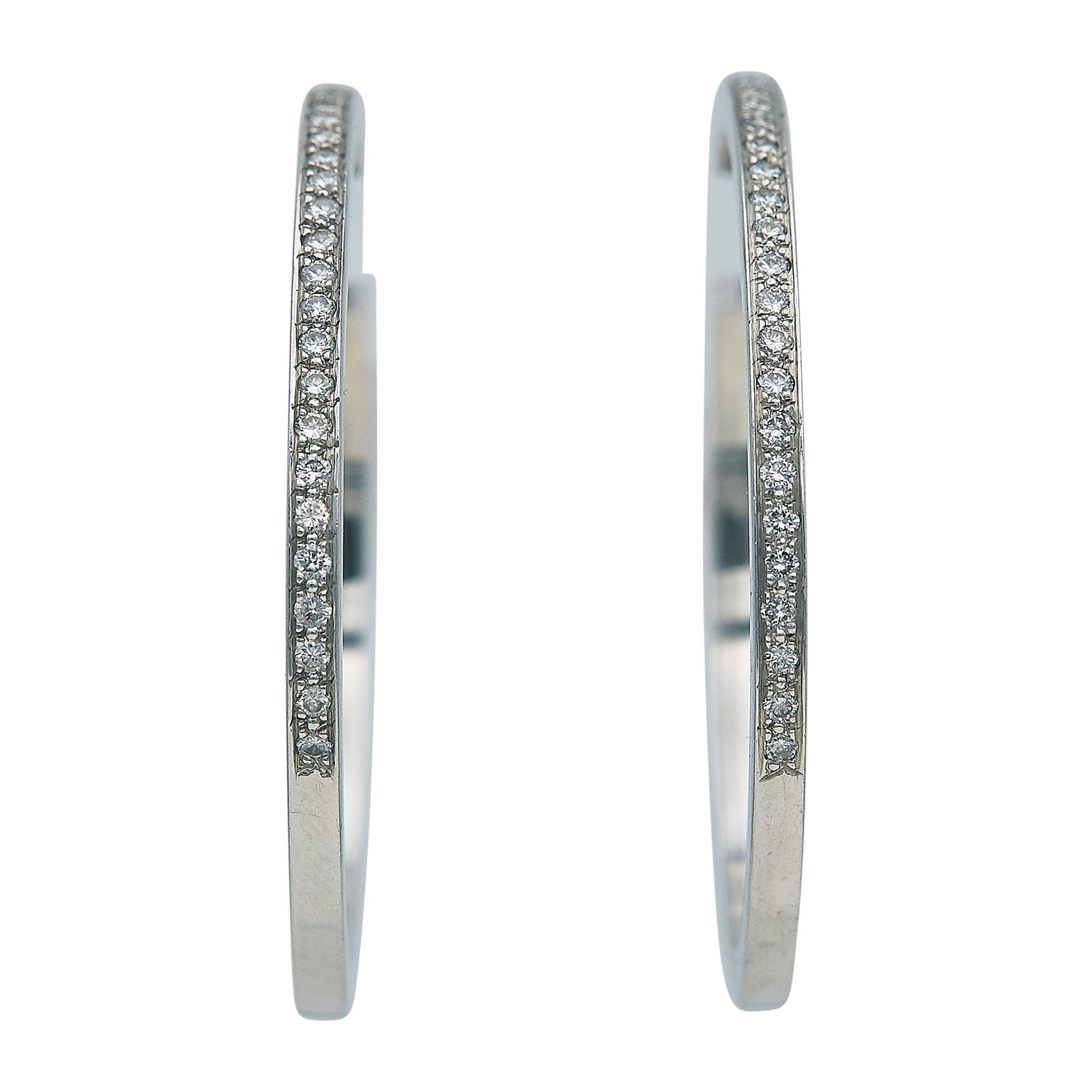 18K White Gold and Diamond Hoop Earrings: METAL: 18K White Gold; APPROXIMATE TOTAL DIAMOND WEIGHT: 0.52 ctw; STAMPED: MJS, 18K; CONDITION: Pre-owned, Very Good; ITEM WEIGHT (GRAMS): 13.79 g; MEASUREMENTS: Earrings 1 7/8 inches in diameter; AD