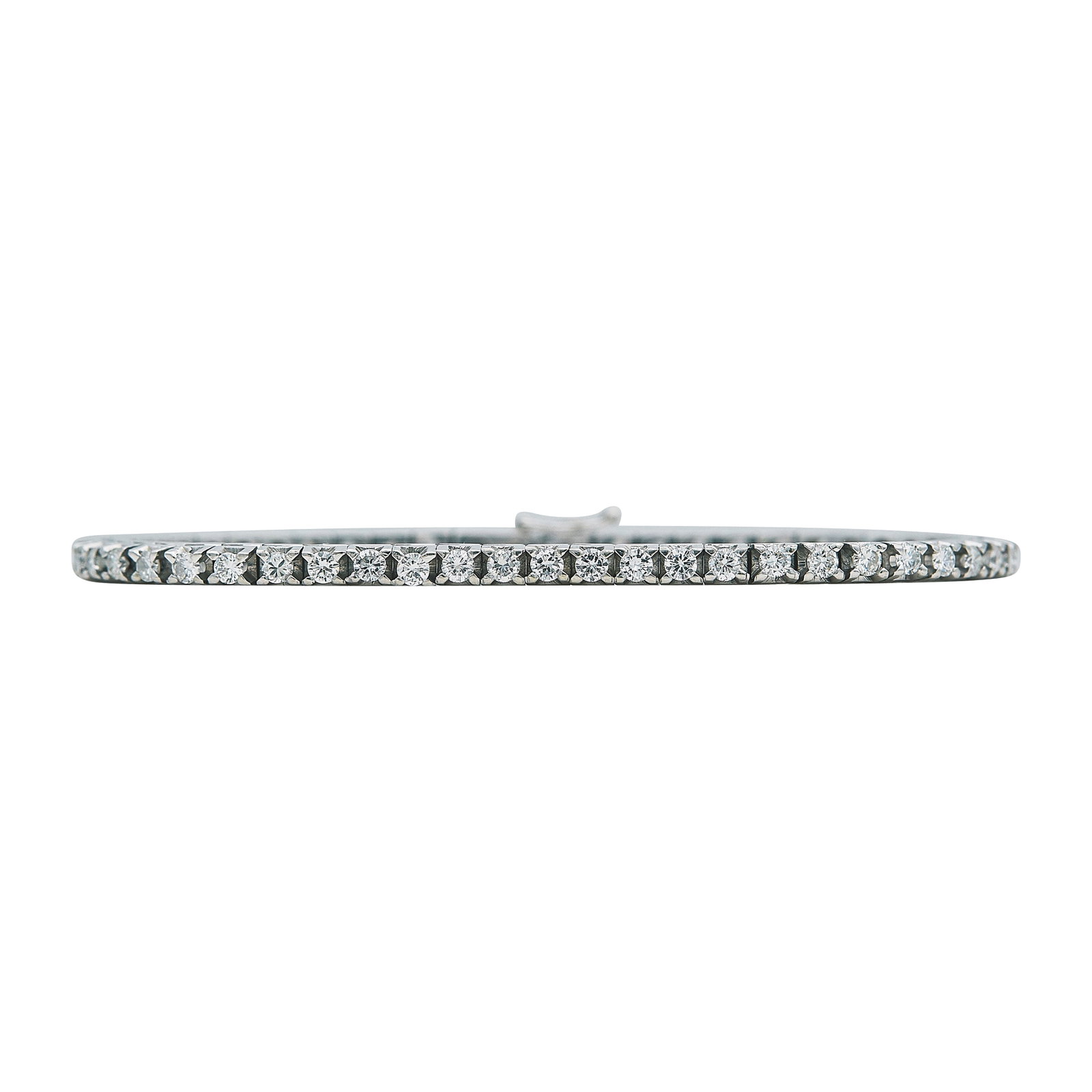 18K White Gold Diamond Tennis Bracelet: METAL: 18K White Gold; APPROXIMATE TOTAL DIAMOND WEIGHT: 2.12 ctw; STAMPED: 750; CONDITION: Pre-owned, Very Good; ITEM WEIGHT (GRAMS): 17.1 g; MEASUREMENTS: Bracelet 7 3/16 inches long