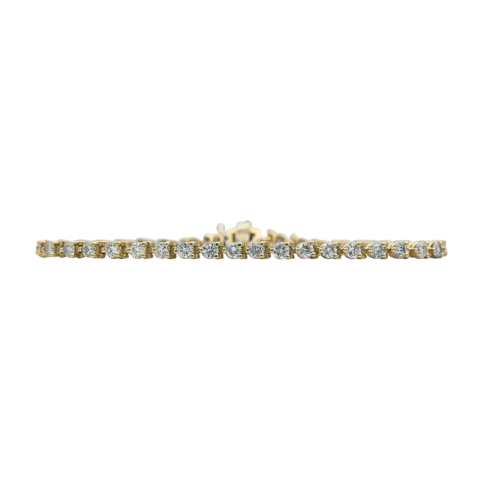 14K Yellow Gold and Diamond Tennis Bracelet: METAL: 14K Yellow Gold; APPROXIMATE TOTAL DIAMOND WEIGHT: 3 ctw; STAMPED: 14K, R; CONDITION: Pre-owned, Good; ITEM WEIGHT (GRAMS): 8 g; MEASUREMENTS: Bracelet 6 1/2 inches long