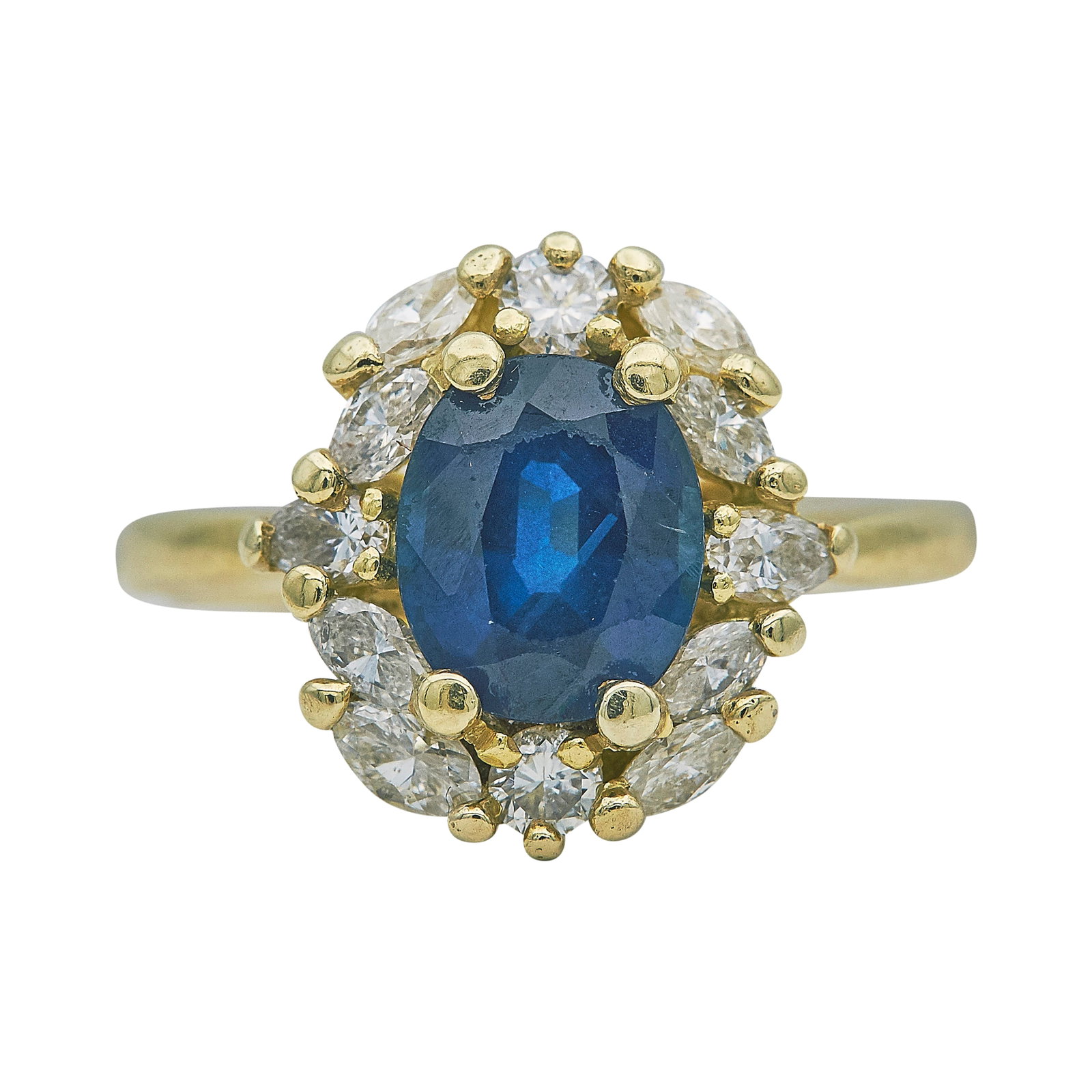 18K Yellow Gold Sapphire and Diamond Cluster Ring: METAL: 18K Yellow Gold; APPROXIMATE TOTAL DIAMOND WEIGHT: 0.35 ctw; GEMSTONES: Sapphire approx. 8.60 mm x 7.40 mm, With abraded facet edges; STAMPED: 18K; CONDITION: Pre-owned, Fair; ITEM WEIGHT (GRAM