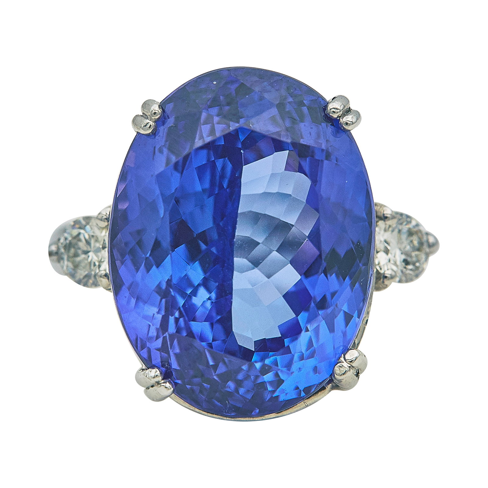 14K White Gold Oval Cut Tanzanite and Diamond Ring: METAL: 14K White Gold; APPROXIMATE TOTAL DIAMOND WEIGHT: 0.50 ctw; GEMSTONES: Tanzanite approx. 26.97 carats, Weight estimated by formula, With two small chips and light scratches on crown; STAMPED: 1