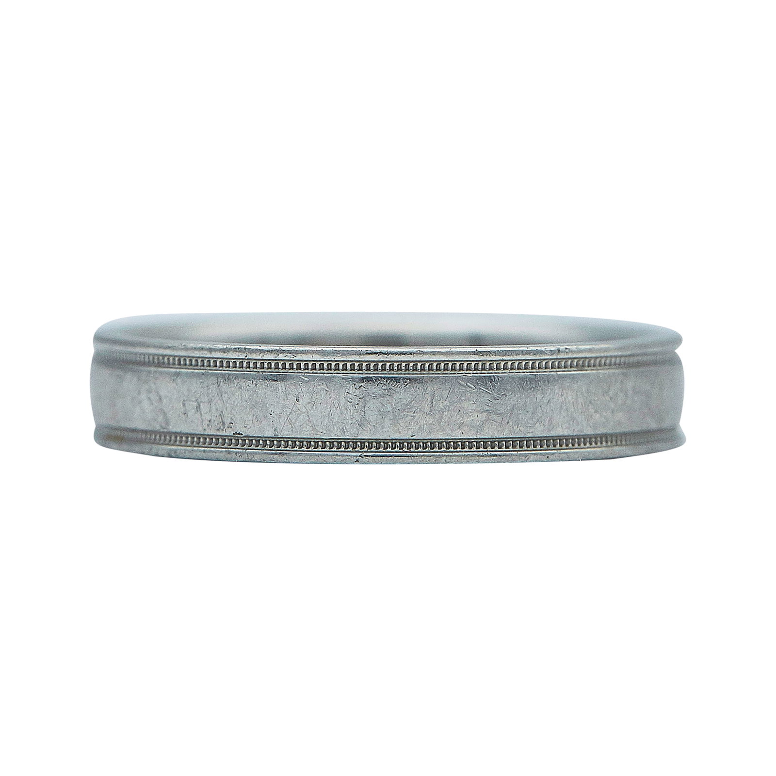 Tiffany & Co. Platinum and Single Diamond Band Ring: BRAND: Tiffany & Co.; METAL: Platinum; APPROXIMATE TOTAL DIAMOND WEIGHT: 0.02 ctw; STAMPED: © Tiffany&Co., Pt. 950; CONDITION: Pre-owned, Good; ITEM WEIGHT (GRAMS): 7 g; MEASUREMENTS: Ring size 7 3/4