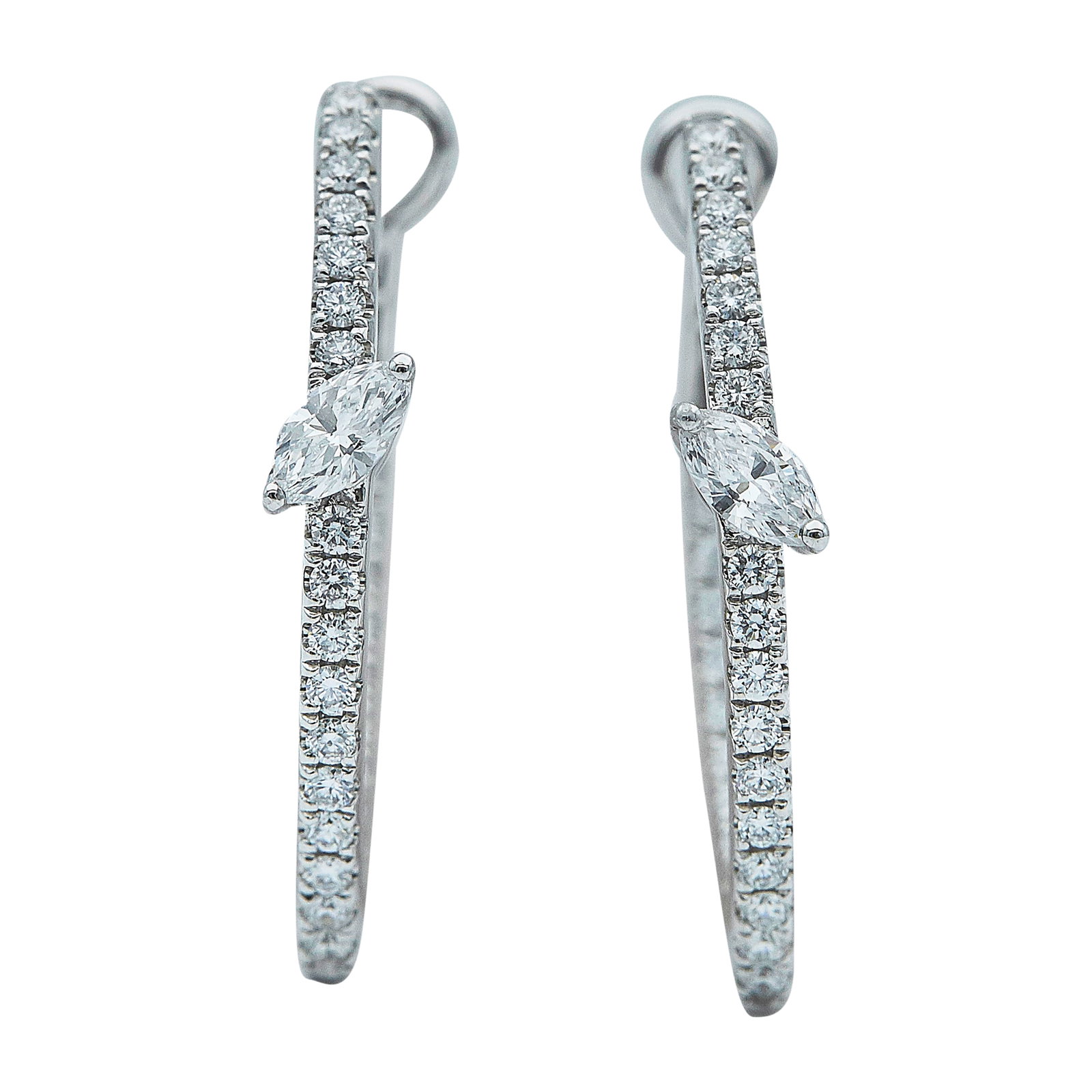 14K White Gold and Diamond Inside-Out Hoop Earrings: METAL: 14K White Gold; APPROXIMATE TOTAL DIAMOND WEIGHT: 0.90 ctw; STAMPED: 14K, 0.30, FS, D0.60; CONDITION: Pre-owned, Very Good; ITEM WEIGHT (GRAMS): 5.2 g; MEASUREMENTS: Earrings 1 inch long x 11/1