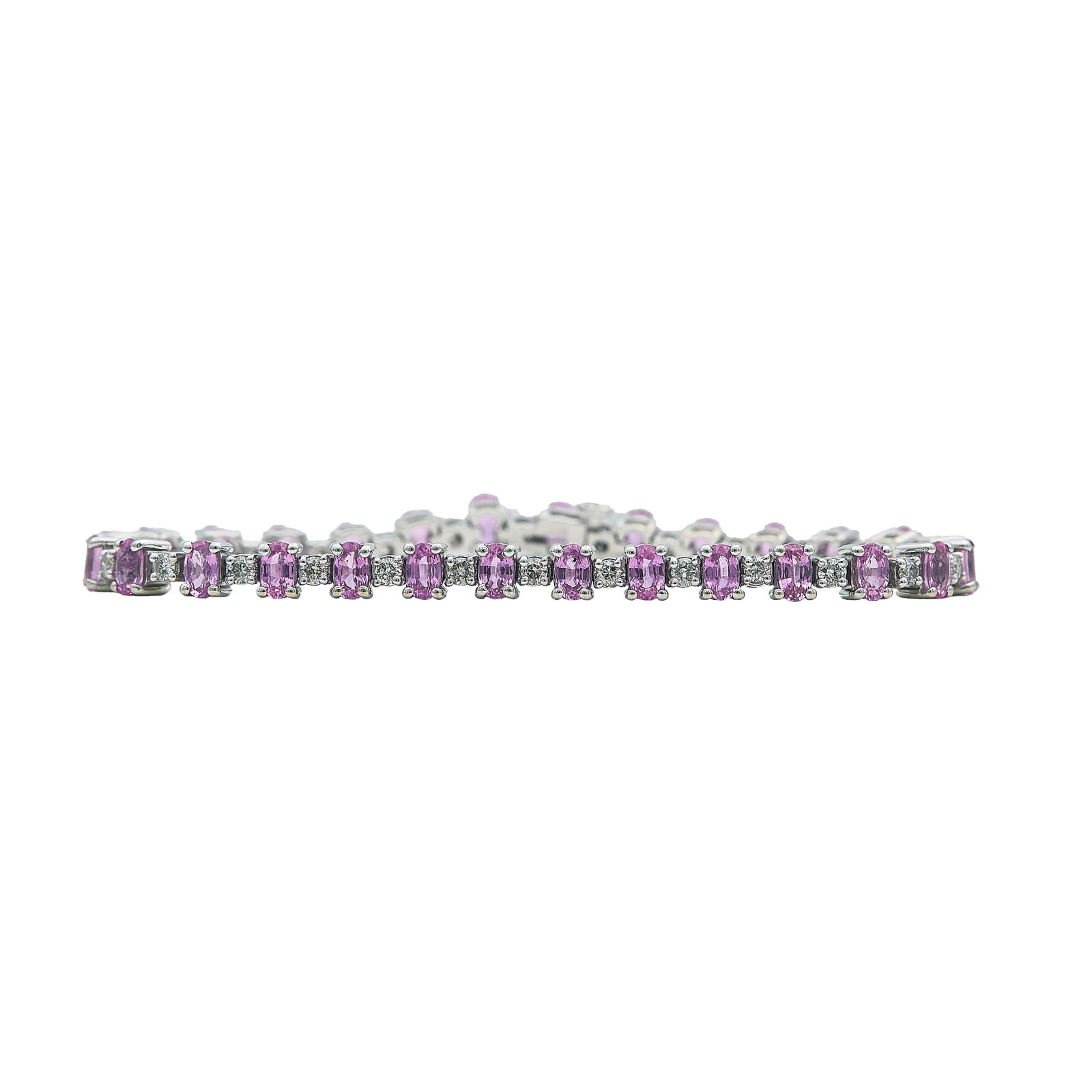 14K White Gold Pink Sapphire and Diamond Tennis Bracelet: METAL: 14K White Gold; APPROXIMATE TOTAL DIAMOND WEIGHT: 1.54 ctw; GEMSTONES: Pink Sapphires approx. 7.00 carats total weight, Weight estimated by formula; STAMPED: 14K, 600; CONDITION: Pre-owned, Ver