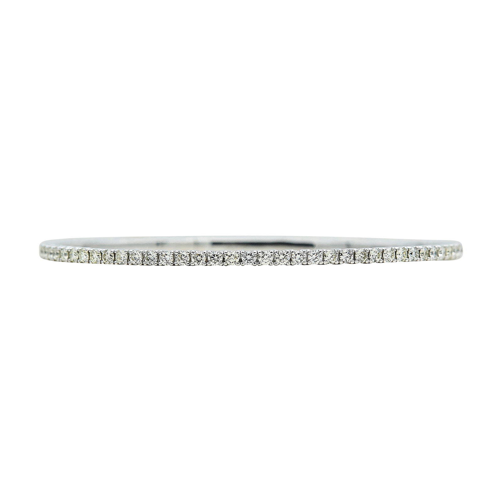 14K White Gold and Diamond Bangle Bracelet: METAL: 14K White Gold; APPROXIMATE TOTAL DIAMOND WEIGHT: 3.70 ctw; STAMPED: 14K, PMI; CONDITION: Pre-owned, Very Good; ITEM WEIGHT (GRAMS): 8.4 g; MEASUREMENTS: Bracelet inner circumference approx. 7 