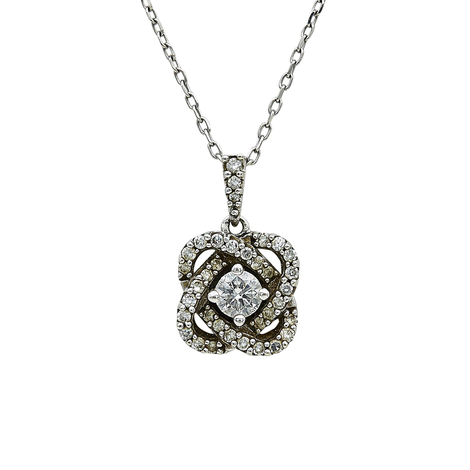 10K White Gold and Diamond Cluster Pendant Necklace: METAL: 10K White Gold; APPROXIMATE TOTAL DIAMOND WEIGHT: 0.65 ctw; STAMPED: IKS, 10K; CONDITION: Pre-owned, Good; ITEM WEIGHT (GRAMS): 2.7 g; MEASUREMENTS: Necklace 18 inches long not including pendan