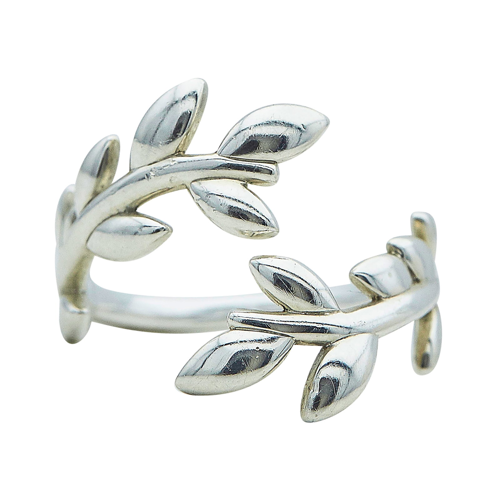 Paloma Picasso for Tiffany & Co. Olive Leaf Sterling Silver Crossover Ring: BRAND: Paloma Picasso for Tiffany & Co.; COLLECTION: Olive Leaf; METAL: Sterling Silver; STAMPED: © Paloma Picasso, T & Co., Ag925; CONDITION: Pre-owned, Very Good; ITEM WEIGHT (GRAMS): 5.3 g; MEASUR