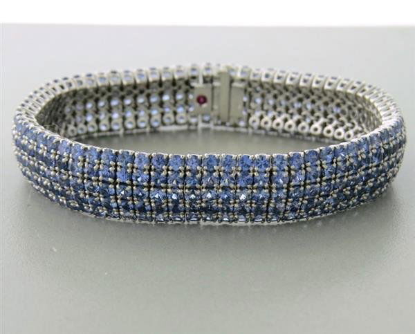Roberto Coin 18k Gold Sapphire Diamond Bracelet: Measurements- bracelet length 7', weight- 41.1 g, gemstones- five rows of sapphires, one diamond, marks- 750 1226 VI Roberto Coin's hallmark embedded ruby, consignor- RZ