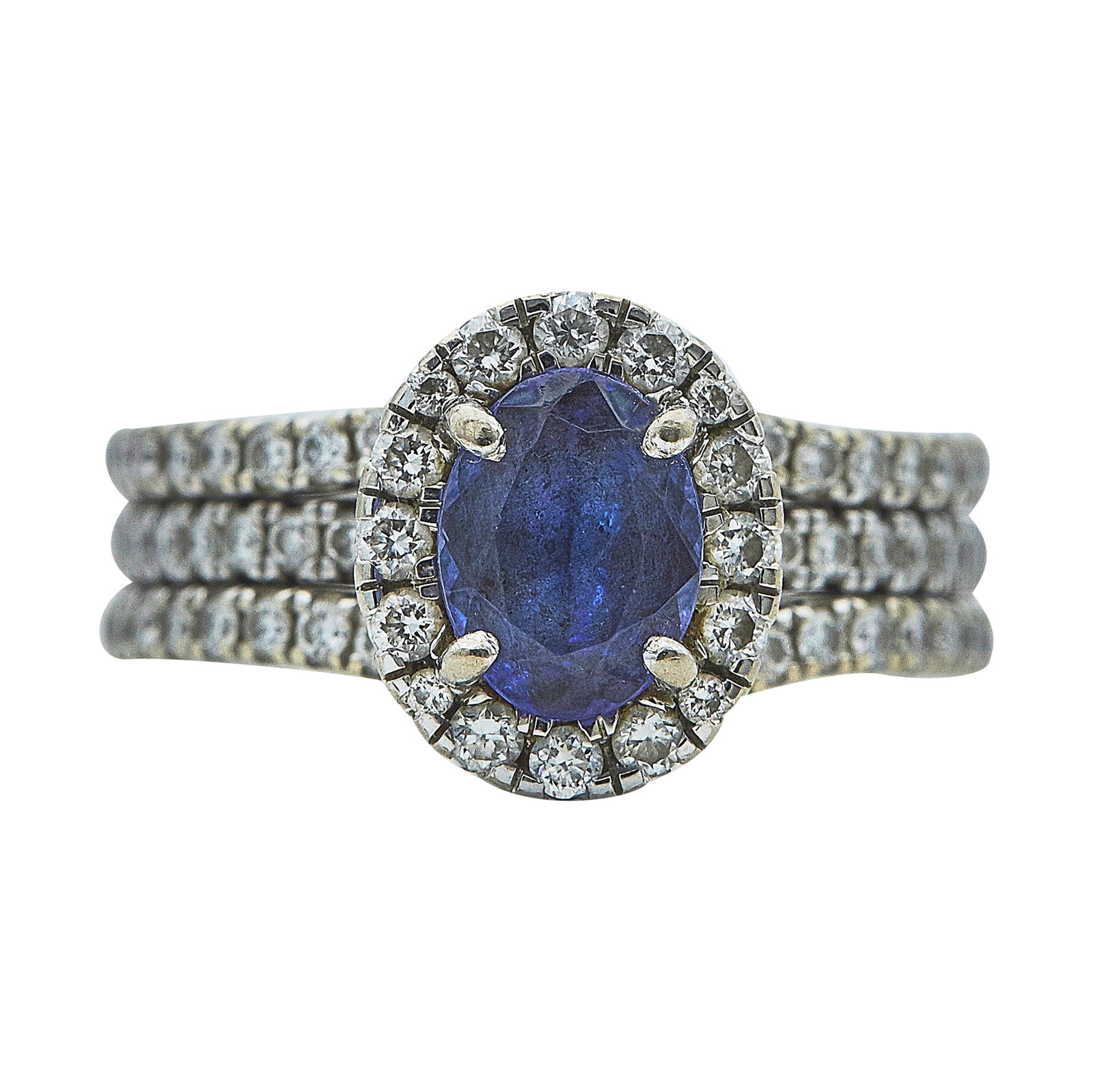 A. Jaffe 14K White Gold, Tanzanite, and Diamond Pave Halo Ring: BRAND: A. Jaffe; METAL: 14K White Gold; APPROXIMATE TOTAL DIAMOND WEIGHT: 1.25 ctw; GEMSTONES: Tanzanite approx. 8.00 mm x 6.00 mm, Scratch on table and chips on crown facet edges; STAMPED: A. Jaffe, 