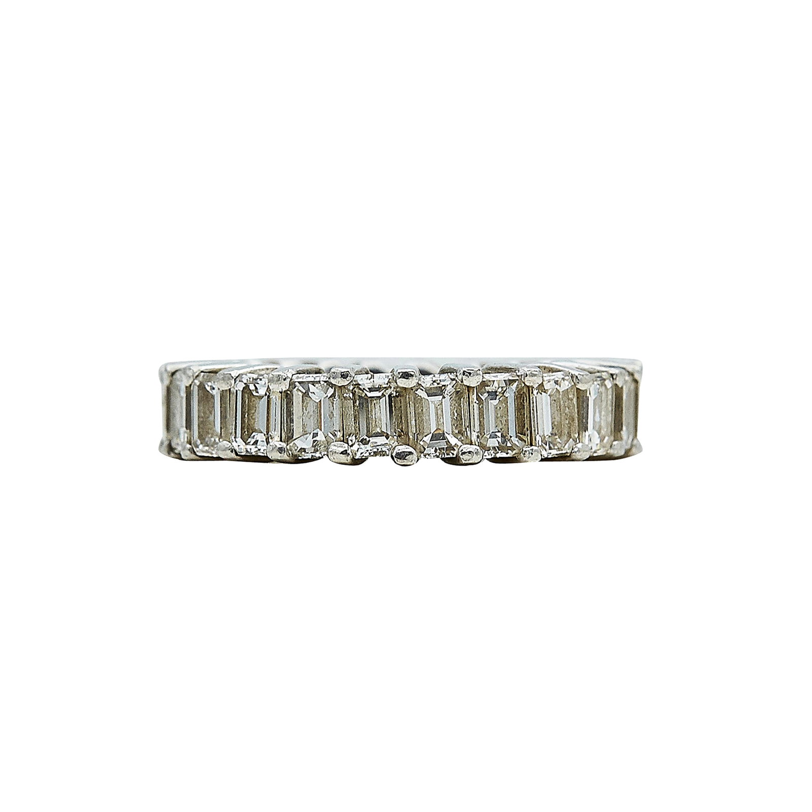 Platinum and Emerald-Cut Diamond Eternity Band Ring: METAL: Platinum; APPROXIMATE TOTAL DIAMOND WEIGHT: 3 ctw; TESTED: Platinum; CONDITION: Pre-owned, Good; ITEM WEIGHT (GRAMS): 9 g; MEASUREMENTS: Ring size 5 1/2; ADDITIONAL COMMENTS: Minor abrasions to