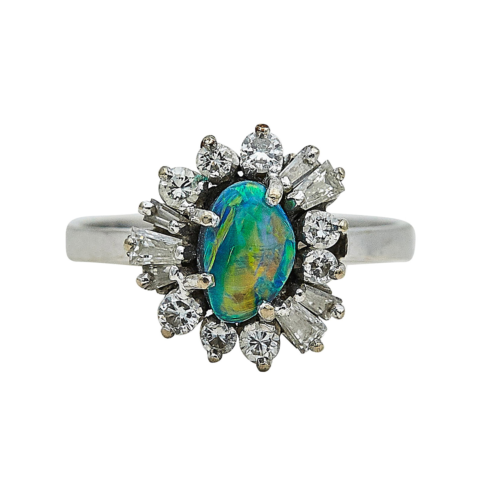 18K White Gold, Opal, and Diamond Cluster Ring: METAL: 18K White Gold; APPROXIMATE TOTAL DIAMOND WEIGHT: 0.35 ctw; GEMSTONES: Opal approx. 7.50 mm x 5.00 mm; STAMPED: 750; CONDITION: Pre-owned, Good; ITEM WEIGHT (GRAMS): 4.6 g; MEASUREMENTS: Ring s