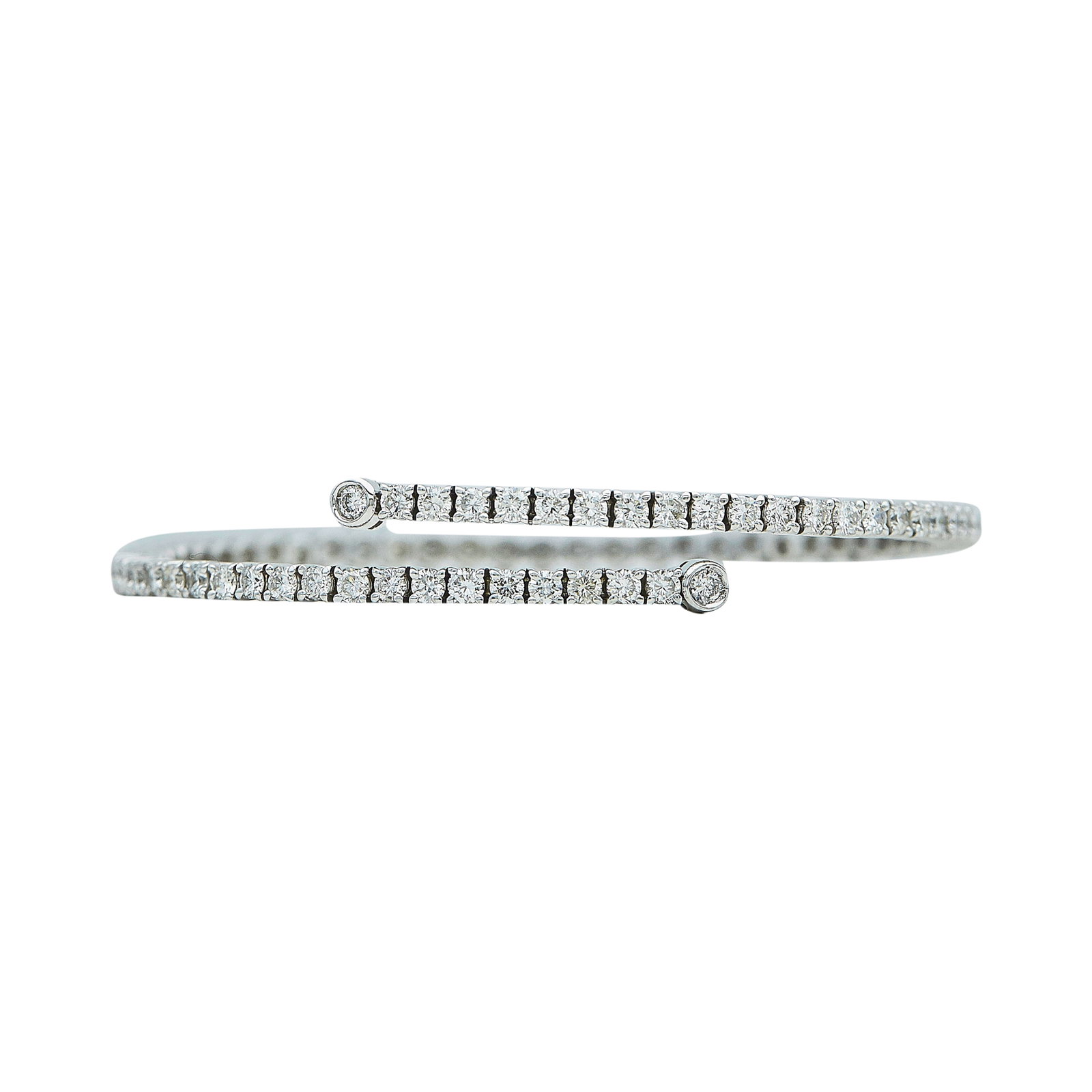 18K White Gold and Diamond Cross-Over Bracelet: METAL: 18K White Gold; APPROXIMATE TOTAL DIAMOND WEIGHT: 1.68 ctw; STAMPED: 750, Italy, Maker's mark; CONDITION: Pre-owned, Very Good; ITEM WEIGHT (GRAMS): 13.4 g; MEASUREMENTS: Bracelet inner circumf