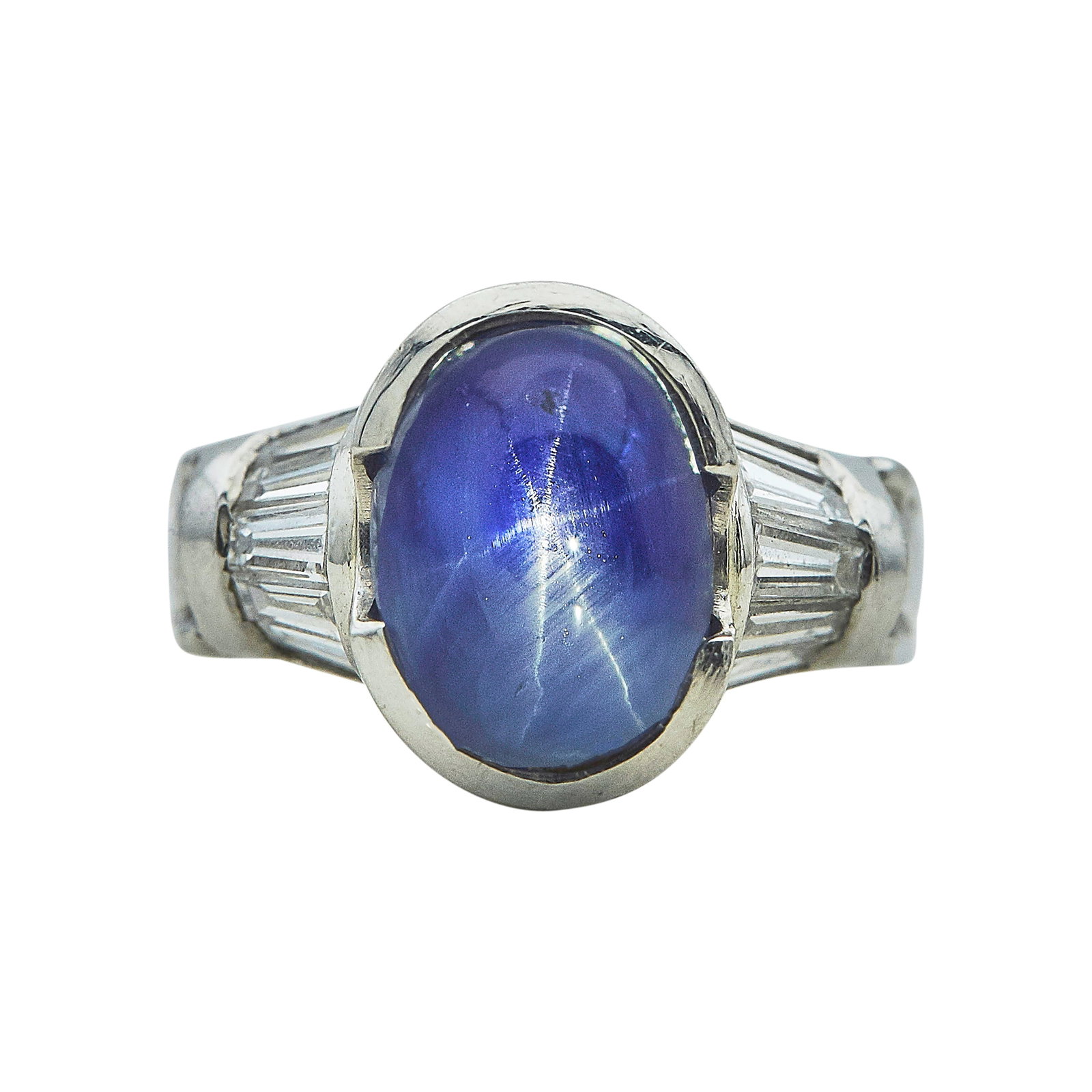 Platinum, Star Sapphire, and Diamond Ring: METAL: Platinum; APPROXIMATE TOTAL DIAMOND WEIGHT: 0.75 ctw; GEMSTONES: Star sapphire approx. 11.00 mm x 8.50 mm; STAMPED: IRID PLAT; CONDITION: Pre-owned, Good; ITEM WEIGHT (GRAMS): 15.3 g; MEASUREME