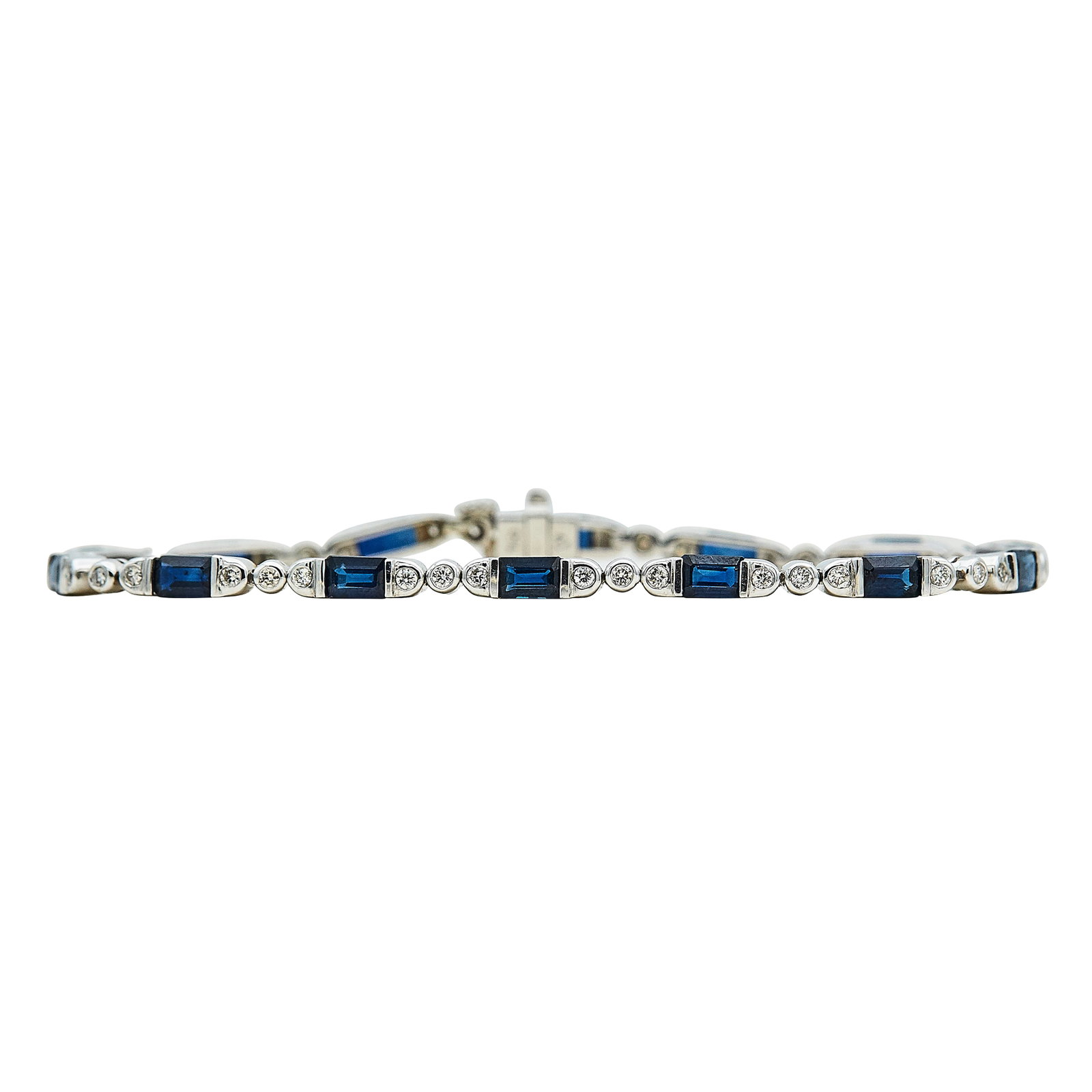 18K White Gold, Sapphire, and Diamond Tennis Bracelet: METAL: 18K White Gold; APPROXIMATE TOTAL DIAMOND WEIGHT: 0.63 ctw; GEMSTONES: Sapphire; STAMPED: 750, maker's mark; CONDITION: Pre-owned, Good; ITEM WEIGHT (GRAMS): 10.4 g; MEASUREMENTS: Bracelet 7 in
