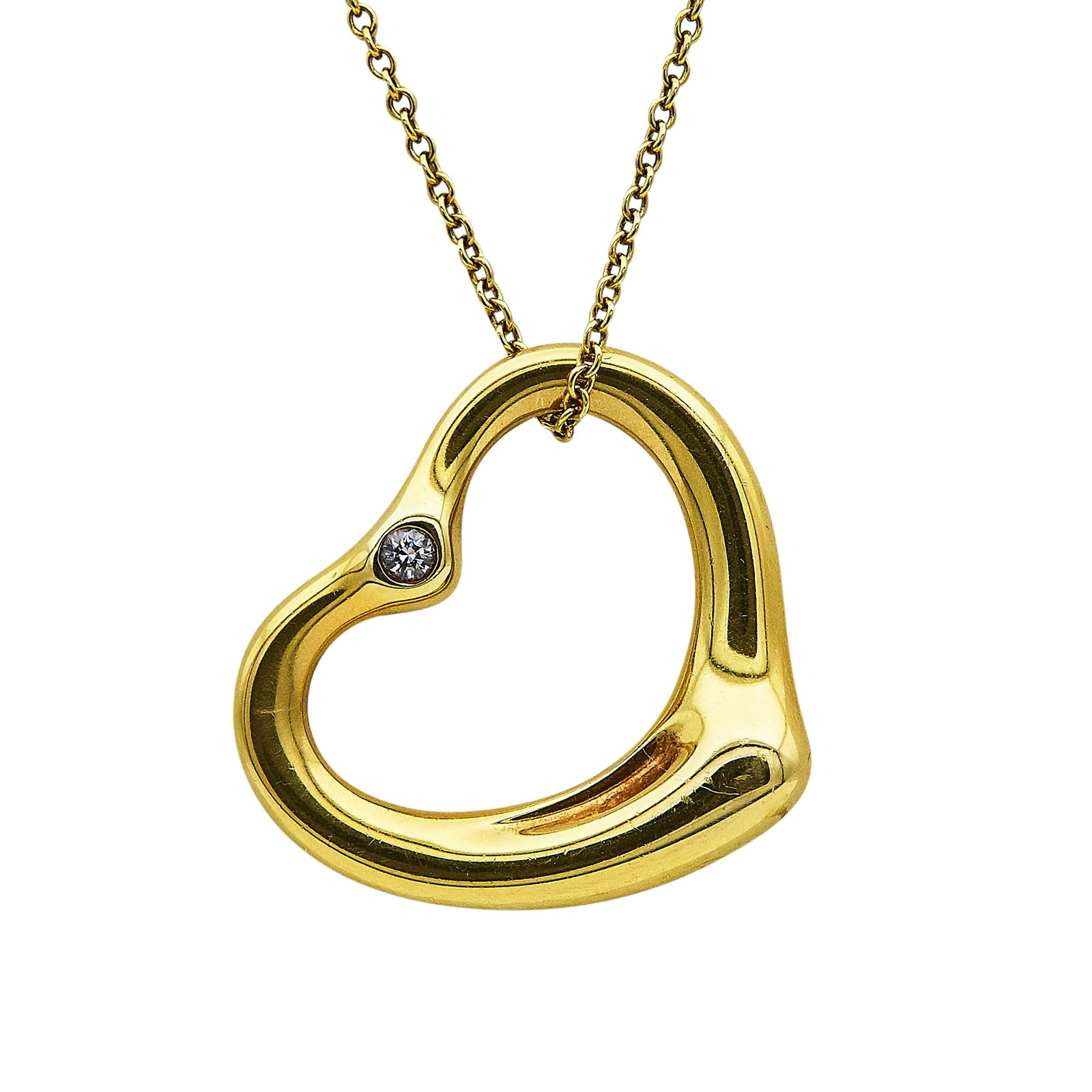 Elsa Peretti for Tiffany & Co. 18K Yellow Gold and Diamond Heart Pendant Necklace: BRAND: Elsa Peretti for Tiffany & Co.; COLLECTION: Open Heart; METAL: 18K Yellow Gold; APPROXIMATE TOTAL DIAMOND WEIGHT: 0.06 ctw; STAMPED: Tiffany & Co., © Elsa Peretti, 750, Spain; CONDITION: Pre-o