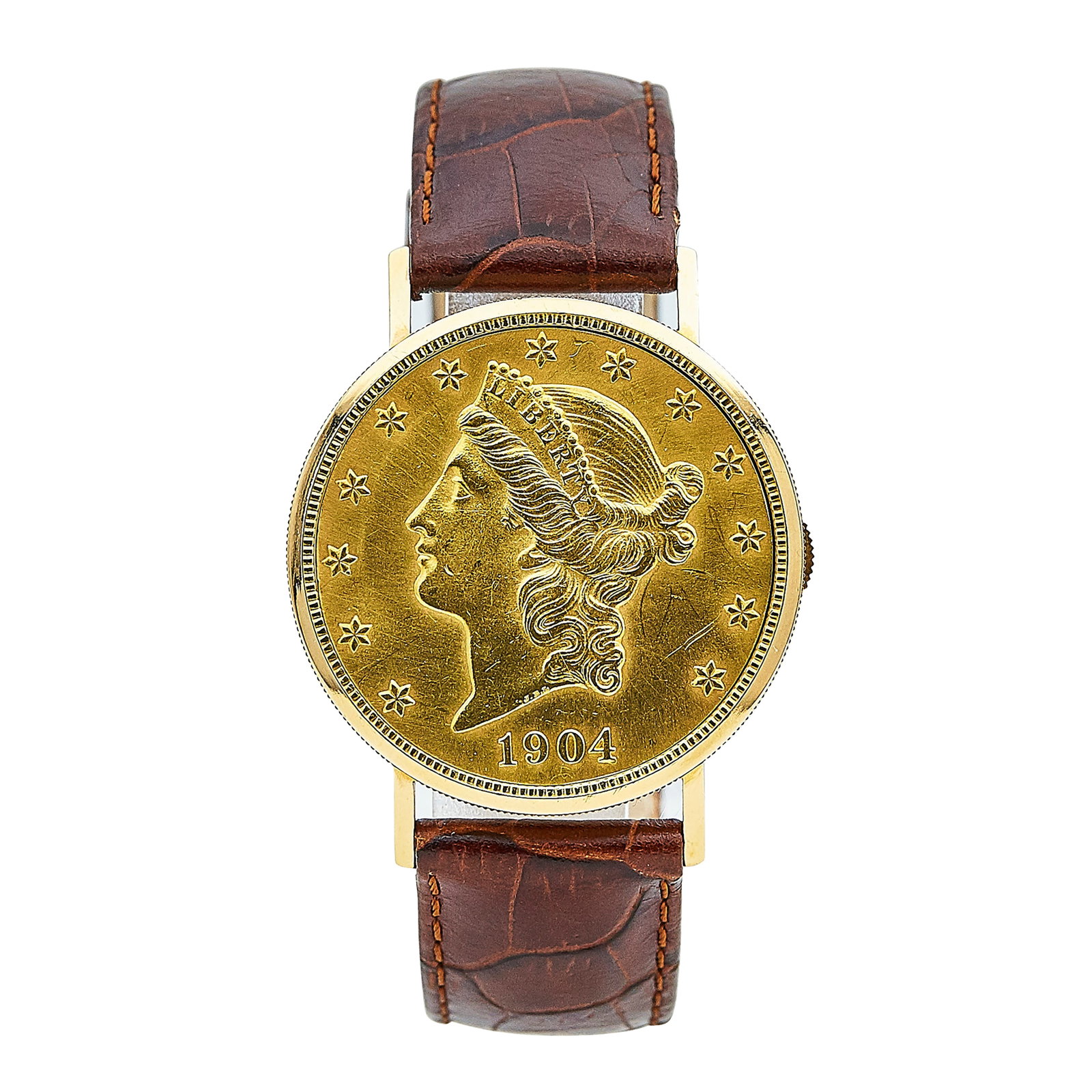 Eska Swiss Liberty Coin 18K Yellow Gold Watch Ref. Unknown, circa Unknown: BRAND: Eska; CONDITION: Pre-owned, Very Good; CASE SIZE (mm): 35; CASE MATERIAL: 18K Yellow Gold; BRACELET STRAP: Leather; BEZEL: 18K Yellow Gold; DIAL COLOR: Champagne; CRYSTAL: Sapphire; CRYSTAL CON