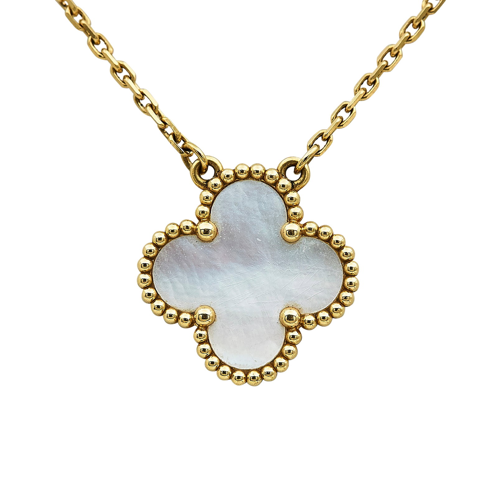 Van Cleef & Arpels Alhambra 18K Yellow Gold and Mother of Pearl Pendant Necklace: BRAND: VCA; COLLECTION: Alhambra; METAL: 18K Yellow Gold; GEMSTONES: Mother of Pearl; STAMPED: VCA, Au750, Serial number, Maker's mark; CONDITION: Pre-owned, Very Good; ITEM WEIGHT (GRAMS): 5.2 g; MEA