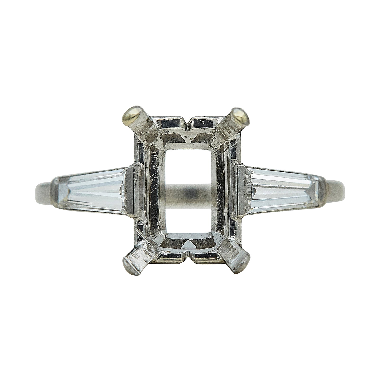 Platinum and Diamond Three Stone Engagement Ring Setting: METAL: Platinum; APPROXIMATE TOTAL DIAMOND WEIGHT: 0.60 ctw; STAMPED: 313, PLAT.; CONDITION: Pre-owned, Very Good; ITEM WEIGHT (GRAMS): 3.6 g; MEASUREMENTS: Ring size 6 3/4, Center will fit approx. 10