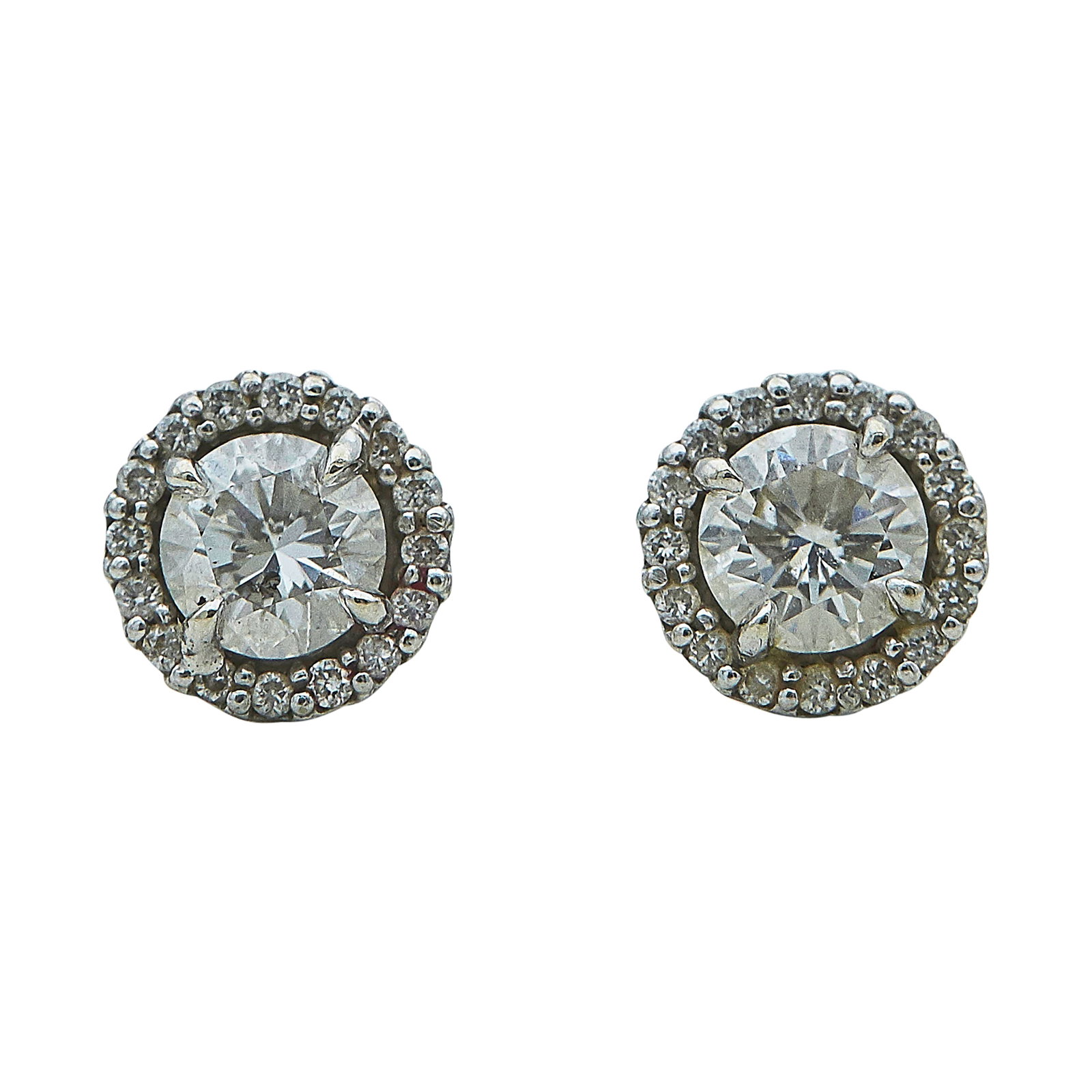 14K White Gold and Diamond Halo Stud Earrings: METAL: 14K White Gold; APPROXIMATE TOTAL DIAMOND WEIGHT: 1.15 ctw; STAMPED: Backs marked: 14KS; TESTED: 14K White Gold; CONDITION: Pre-owned, Very Good; ITEM WEIGHT (GRAMS): 1.3 g; MEASUREMENTS: Earri
