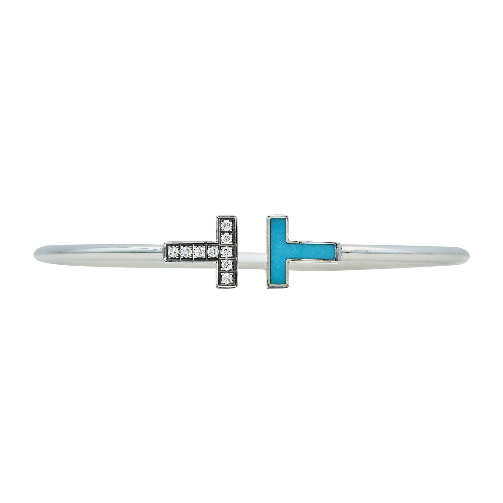 Tiffany & Co. Tiffany T 18K White Gold, Turquoise, and Diamond Wire Bracelet: BRAND: Tiffany & Co.; COLLECTION: Tiffany T; METAL: 18K White Gold; APPROXIMATE TOTAL DIAMOND WEIGHT: 0.11 ctw; GEMSTONES: Turquoise; STAMPED: © T& Co., Au750, Italy, d0.11ct; CONDITION: Pre-owned, V