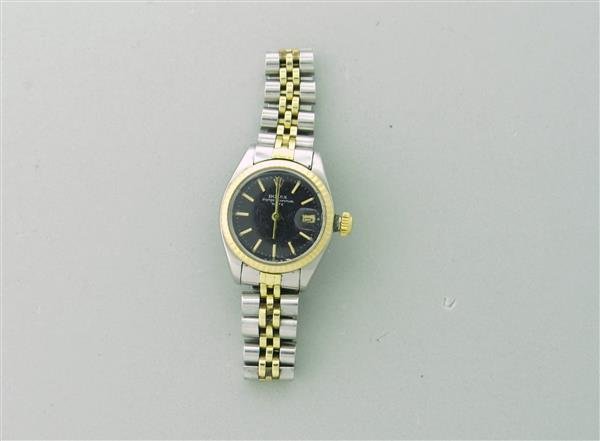 1981 Rolex Oyster Perpetual Ladies Automatic Watch Ref.: RolexOyster PerpetualStem/Date @ 3 o'clockAutomatic movementScrew Down crownDial: Black with applied batons Acrylic CrystalRolex Steel BraceletGender/Size: LadiesRound Case: 26 mm in diameterNo Bo