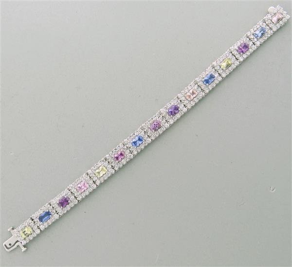 14K Gold Multi Colored Sapphire Diamond Tennis Bracelet: Metal: 14K White Gold, Gemstones/Diamonds - Sapphire - 12 count - approx. 10.00ctw., Diamonds - approx. 6.00-6.5ctw., Measurements: Bracelet is 7" Long and 9.6mm wide, Marked: 14K, Weight: 29.9g