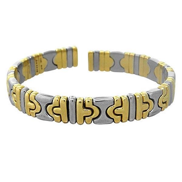 Bvlgari Bulgari Parentesi 18k Gold Stainless Steel Cuff: Metal: 18K Yellow Gold/Stainless Steel, Measurements: bracelet will fit up to 7" wrist and is 9mm wide, Marked: BD9205,Bvlgari,750, Weight: 37.6g