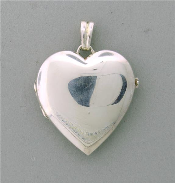 Tiffany & Co. Sterling Silver Heart Locket Pendant: Metal: Sterling Silver, Measurements: 36mm long and 35mm at widest point, Marked: Tiffany & Co., 925, Weight: 8.8g