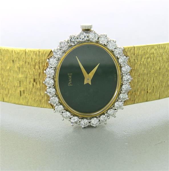 Piaget Gold Jade Diamond Watch: Manual wind, 67.1 grams. approx. 1.30-1.40ctw in diamonds. Jade dial. 6 1/2" long bracelet. Head is 28mm x 24mm.