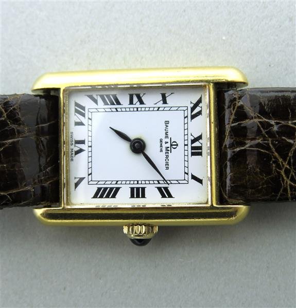 Baume & Mercier 18k Gold Watch: Manual wind,18k yellow gold case 28mm x 20mm.