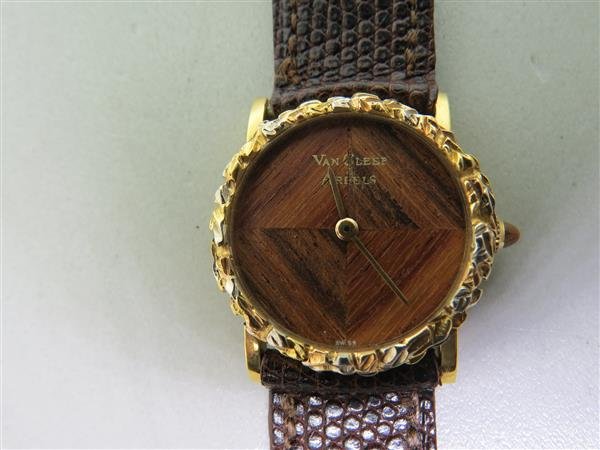 Van Cleef & Arpels 1970s Wood Dial Watch: Vintage 1970s VCA watch. Original buckle,wood dial. Manual movement by Gerald Genta. Case - 24mm in diameter. bracelet 7 3/4" long. weight - 22.1g
